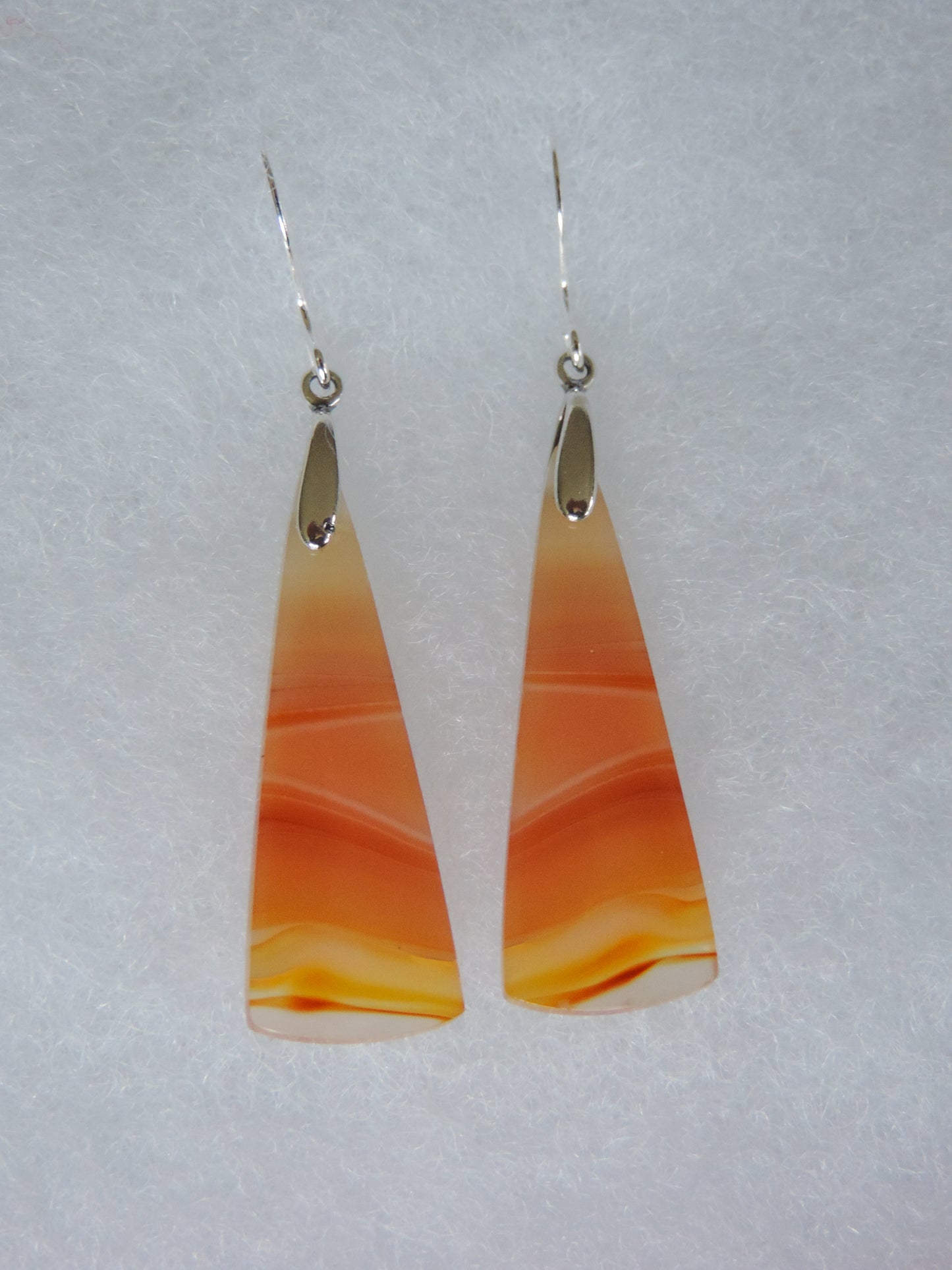 Carnelian Agate & Sterling Silver Earrings. Indonesian Agates exhibit a wide variety of colors and amazing complexity. No two agates are exactly alike, each one being a unique and beautiful creation! Agates with multiple bands of color are known as fortification agates, those with dendritic or moss looking inclusions are referred to as moss agate and many others are given descriptive names relative to their appearance or where they are found
