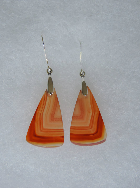 Carnelian Agate & Sterling Silver Earrings.  Indonesian Agates exhibit a wide variety of colors and amazing complexity.  No two agates are exactly alike, each one being a unique and beautiful creation!  Agates with multiple bands of color are known as fortification agates, those with dendritic or moss looking inclusions are referred to as moss agate and many others are given descriptive names relative to their appearance or where they are found.