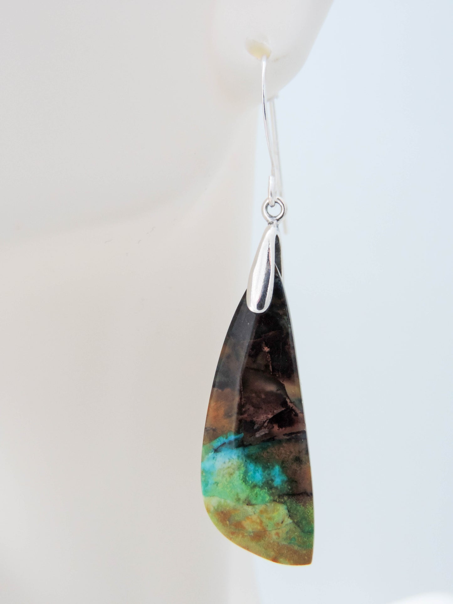 These rich minerals are responsible for the amazing colors in the stone. The bail and earring wires are authentic 925 sterling silver. Feel treasured when you wear these Indonesian Blue Opalized Wood Earrings!