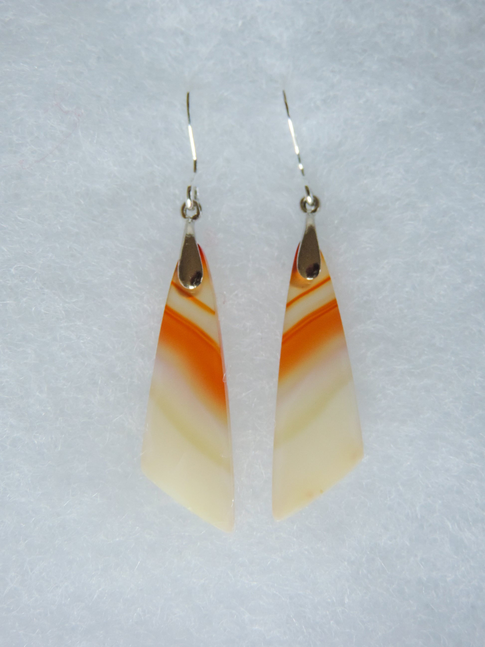 Carnelian Agate & Sterling Silver Earrings.  Indonesian Agates exhibit a wide variety of colors and amazing complexity.  No two agates are exactly alike, each one being a unique and beautiful creation!  Agates with multiple bands of color are known as fortification agates, those with dendritic or moss looking inclusions are referred to as moss agate and many others are given descriptive names relative to their appearance or where they are found.