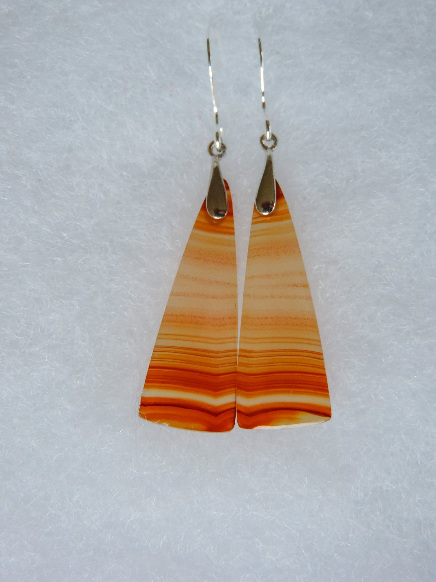 Carnelian Agate & Sterling Silver Earrings. Indonesian Agates exhibit a wide variety of colors and amazing complexity. No two agates are exactly alike, each one being a unique and beautiful creation! Agates with multiple bands of color are known as fortification agates, those with dendritic or moss looking inclusions are referred to as moss agate and many others are given descriptive names relative to their appearance or where they are found.