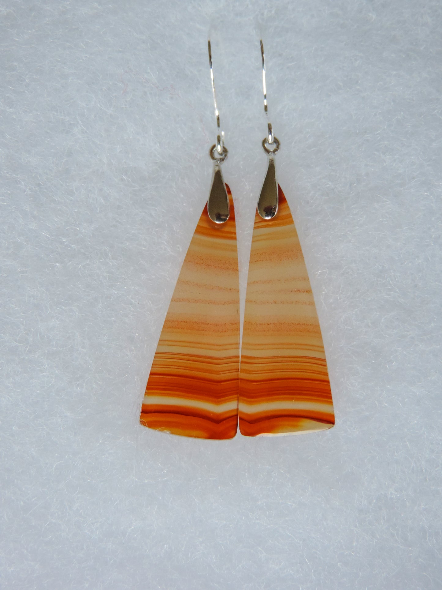 This Carnelian stone is a natural color, no dyes or heat treatment have been used. It was photographed without filters on automatic setting in natural light; however, slight color variations may occur due to digitization. Natural stones can have nooks and crannies, inclusions or small cracks, these distinguishing features lend character to the piece.