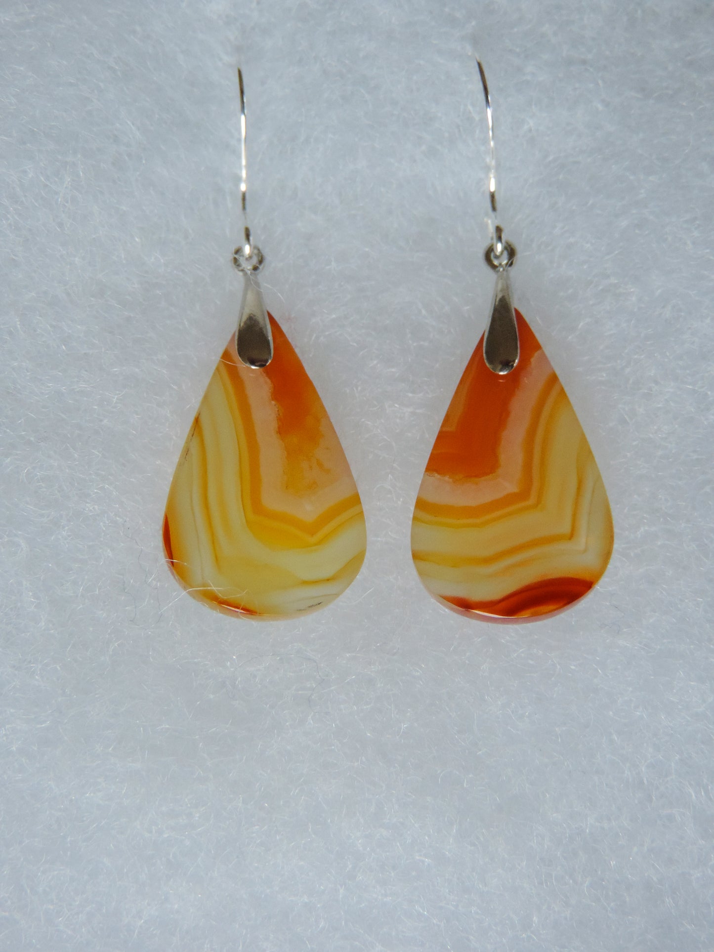 Carnelian Agate & Sterling Silver Earrings.  Indonesian Carnelian Agates exhibit a wide variety of colors and amazing complexity.  No two agates are exactly alike, each one being a unique and beautiful creation!  Agates with multiple bands of color are known as fortification agates, those with dendritic or moss looking inclusions are referred to as moss agate and many others are given descriptive names relative to their appearance or where they are found.