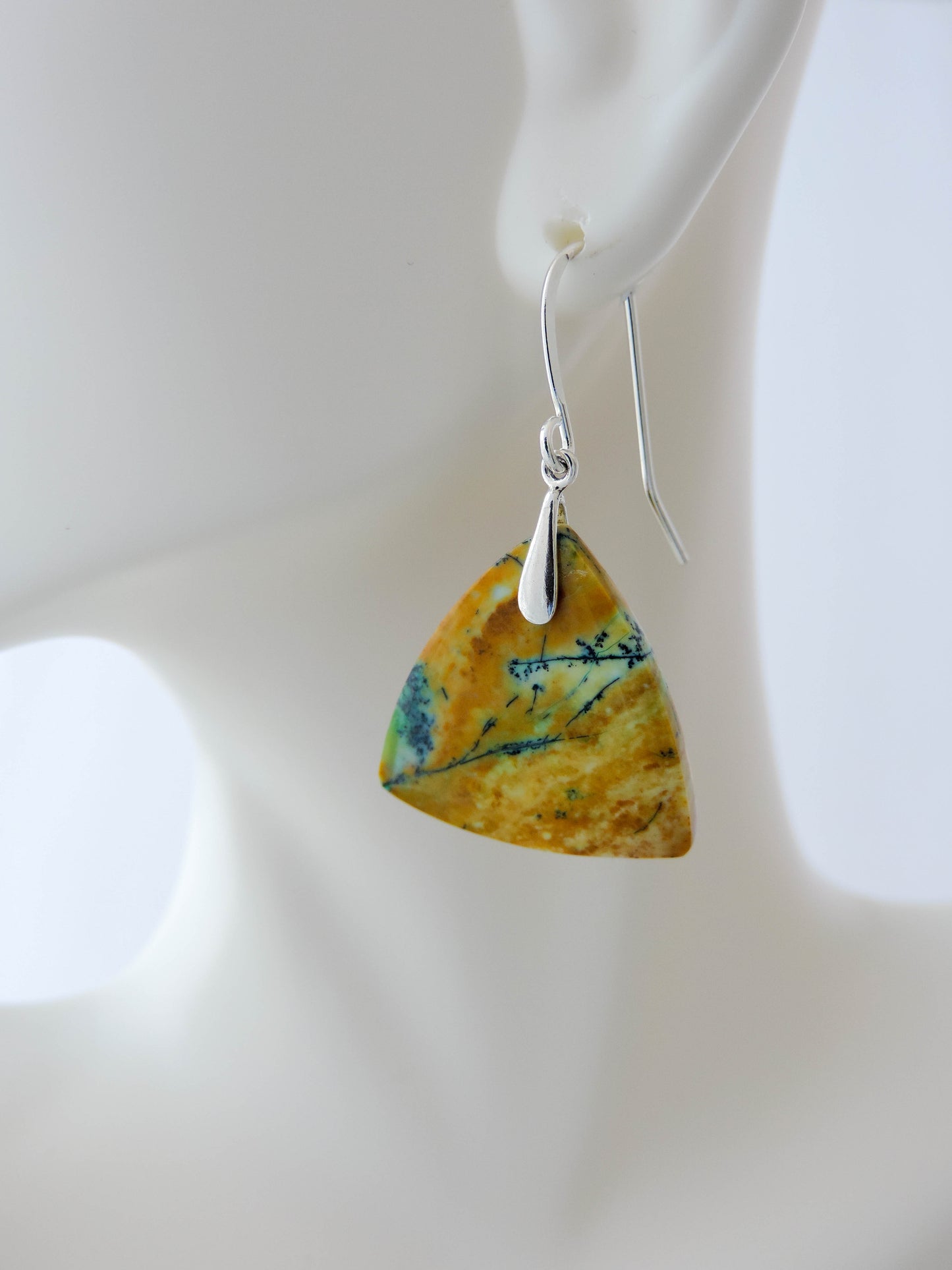 Extremely rare and lovely, Indonesian Blue Opalized Wood is a cherished material used by lapidary artists for creating stunning pieces of jewelry. The material was first found as pebbles and rounded stones in streams and near the slopes of three volcanoes in the West Java Province. The bail and earring wires are authentic 925 sterling silver. Indonesian Blue Opalized Wood Earrings with Sterling Silver, a gorgeous semi-precious gemstone! Feel treasured when you wear these earrings!