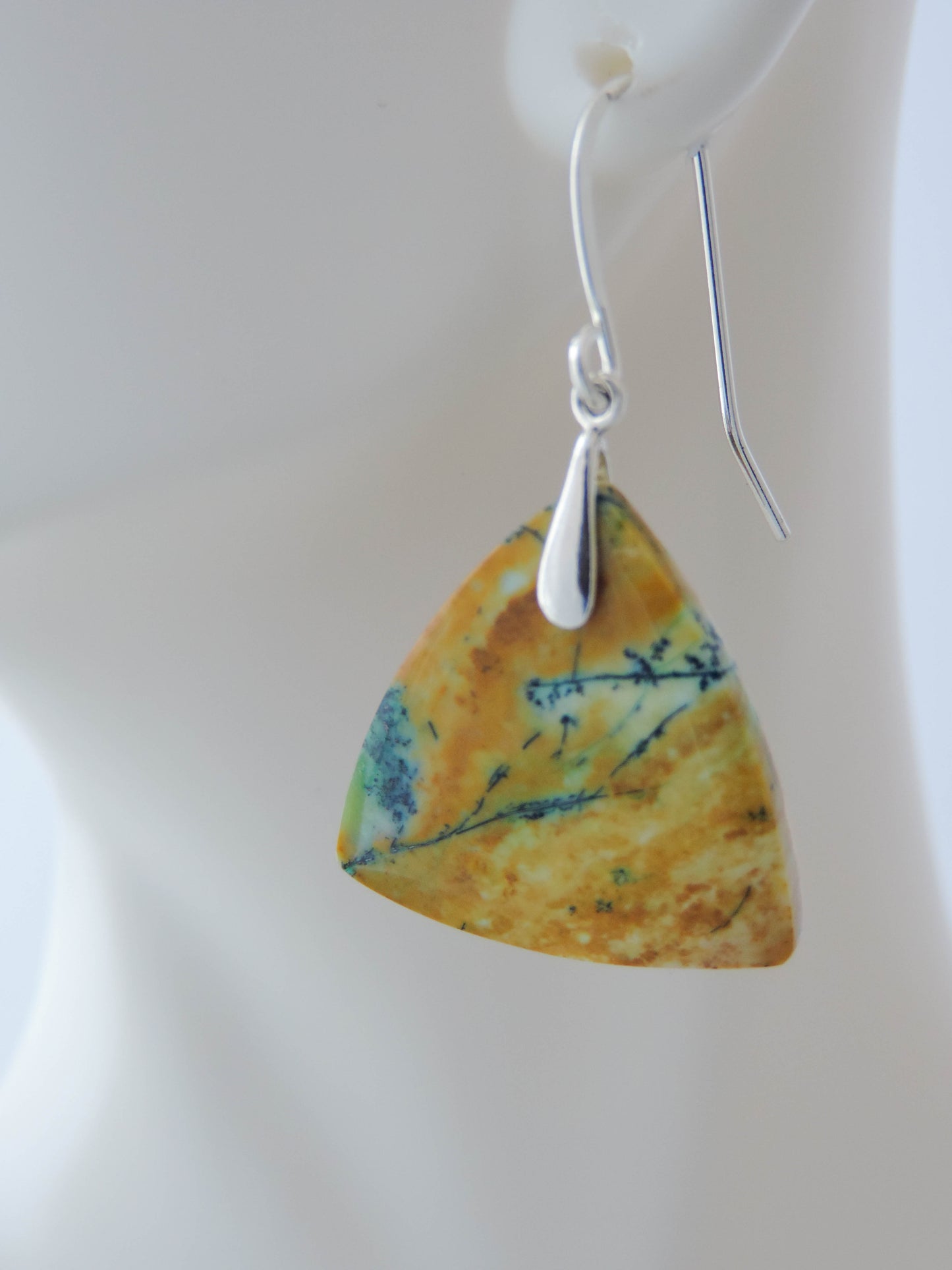 Blue opalized wood earrings. Extremely rare and lovely, Indonesian Blue Opalized Wood is a cherished material used by lapidary artists for creating stunning pieces of jewelry. The material was first found as pebbles and rounded stones in streams and near the slopes of three volcanoes in the West Java Province. The bail and earring wires are authentic 925 sterling silver. Feel treasured when you wear these earrings!