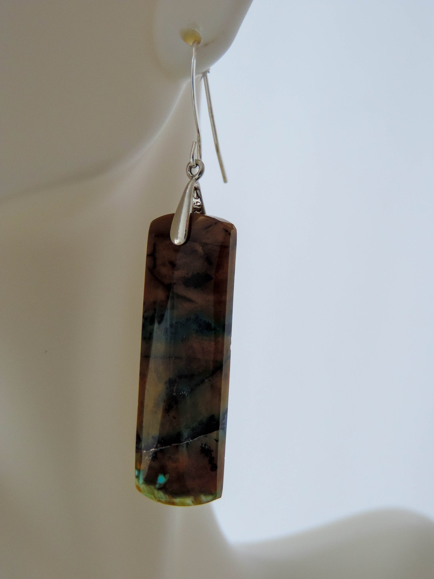 Indonesian Blue Opalized Wood Earrings with Sterling Silver, beautiful jewelry!!Extremely rare and lovely, Indonesian Blue Opalized Wood is a cherished material used by lapidary artists for creating stunning pieces of jewelry.  The material was first found as pebbles and rounded stones in streams and near the slopes of three volcanoes in the West Java Province.