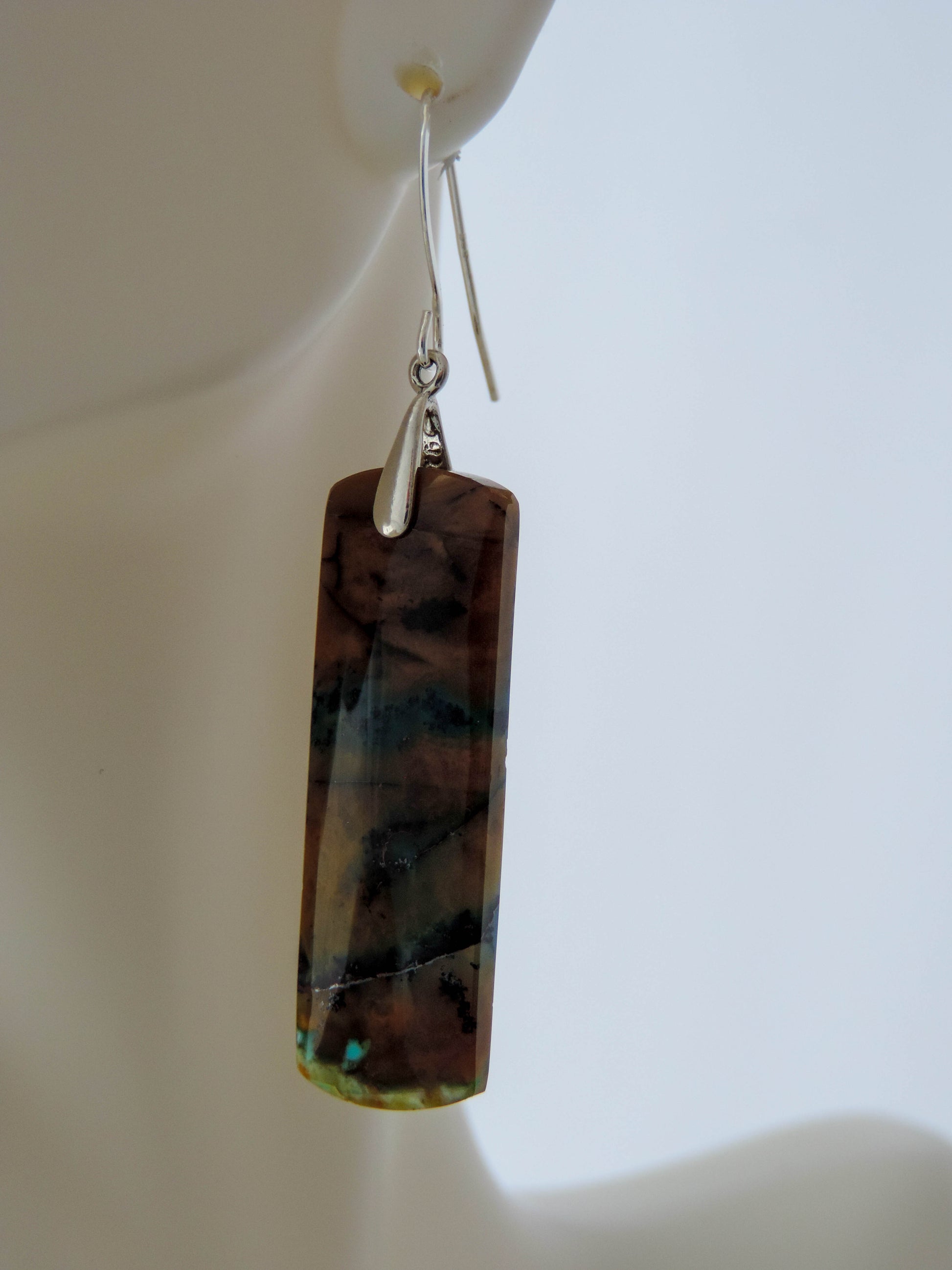 Indonesian Blue Opalized Wood Earrings with Sterling Silver, beautiful jewelry!!Extremely rare and lovely, Indonesian Blue Opalized Wood is a cherished material used by lapidary artists for creating stunning pieces of jewelry.  The material was first found as pebbles and rounded stones in streams and near the slopes of three volcanoes in the West Java Province.