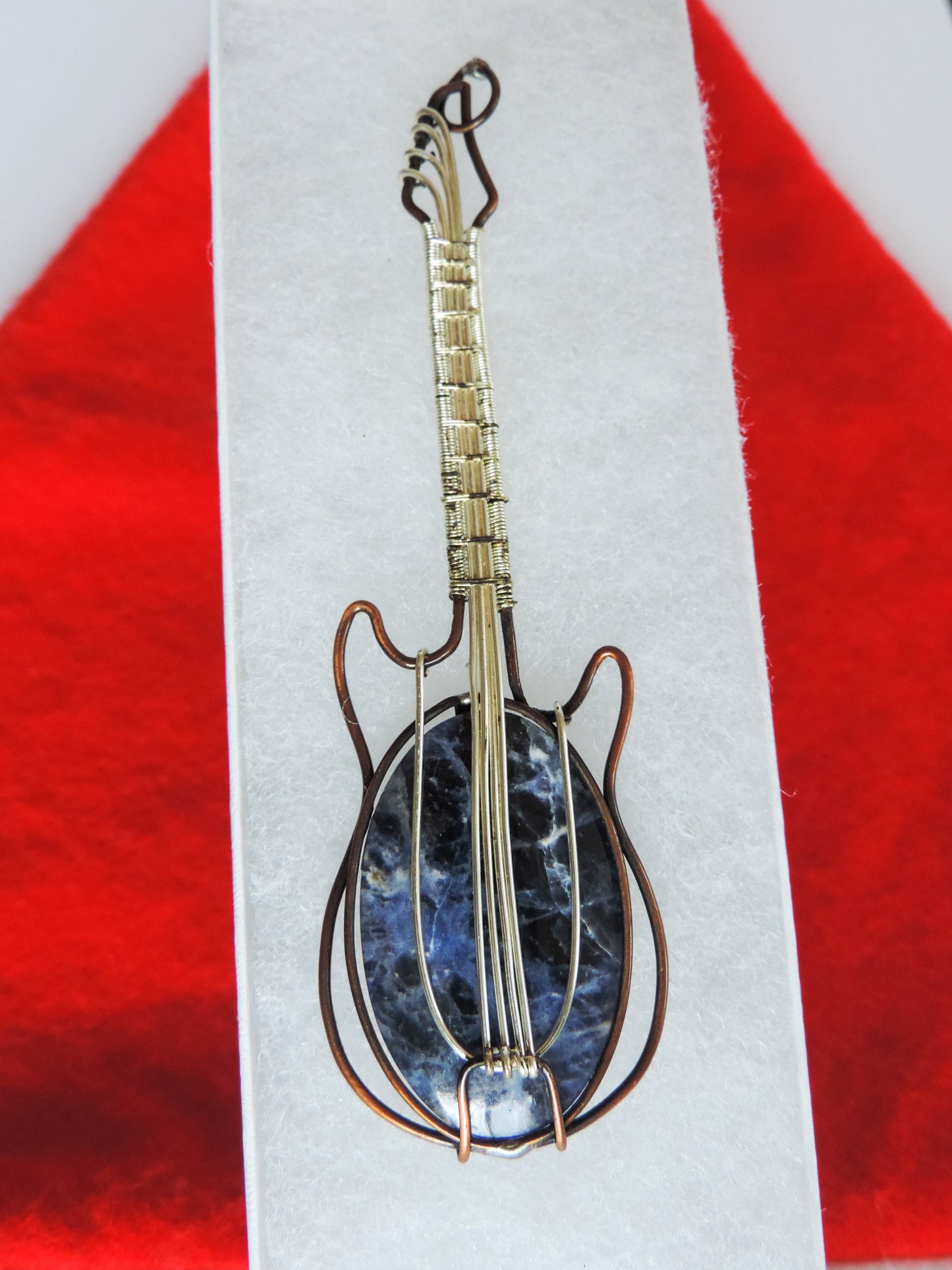 Semi-precious Gemstone and Mixed Metals Guitar Pendant. Semi-precious Gemstone and Mixed Metals One of a kind pendant that shows off your unique taste!