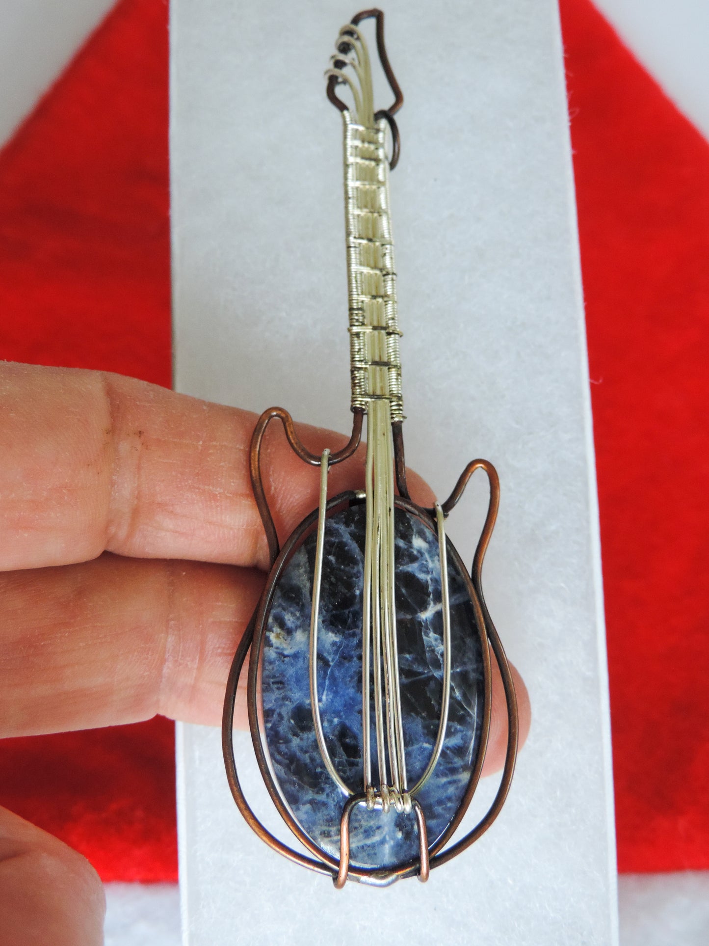 Semi-precious Gemstone and Mixed Metals Guitar Pendant. Semi-precious Gemstone and Mixed Metals One of a kind pendant that shows off your unique taste!