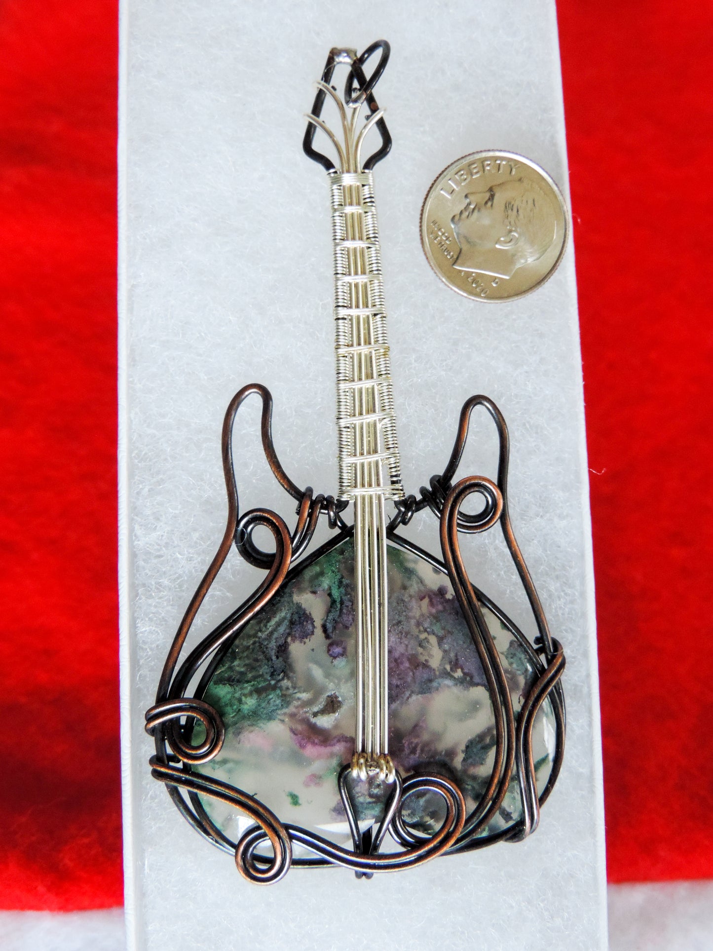 Moss Agate and Mixed Metals Guitar Pendant. Moss Agate and Mixed Metals One of a kind pendant that shows off your unique taste!