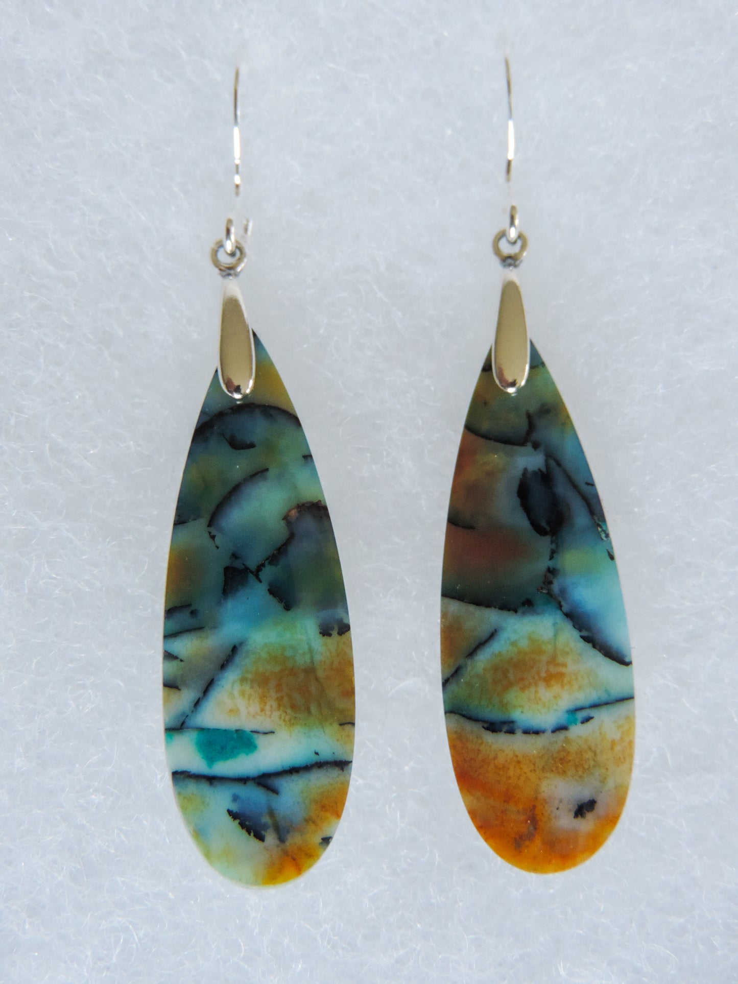 Indonesian Blue Opalized Wood & Sterling Silver Earrings. Feel treasured when you wear these earrings! Extremely rare and lovely, Indonesian Blue Opalized Wood is a cherished material used by lapidary artists for creating stunning pieces of jewelry. The material was first found as pebbles and rounded stones in streams and near the slopes of three volcanoes in the West Java Province.