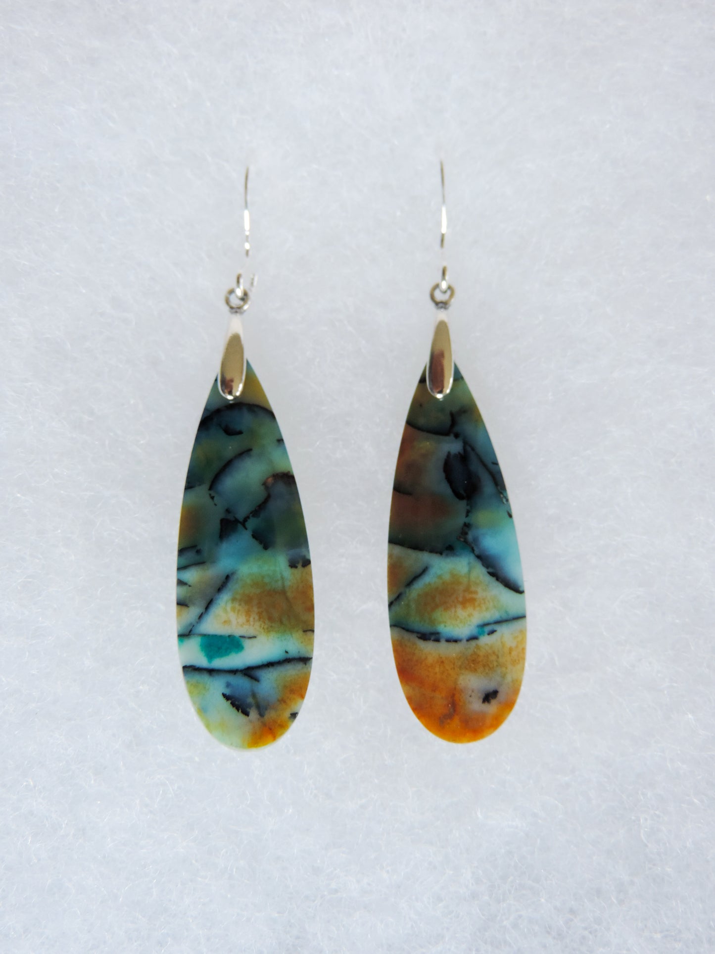 This stone is a natural color, no dyes or heat treatment have been used. It was photographed without filters on automatic setting in natural light; however, slight color variations may occur due to digitization. Natural stones can have nooks and crannies, inclusions or small cracks, these distinguishing features lend character to the piece.