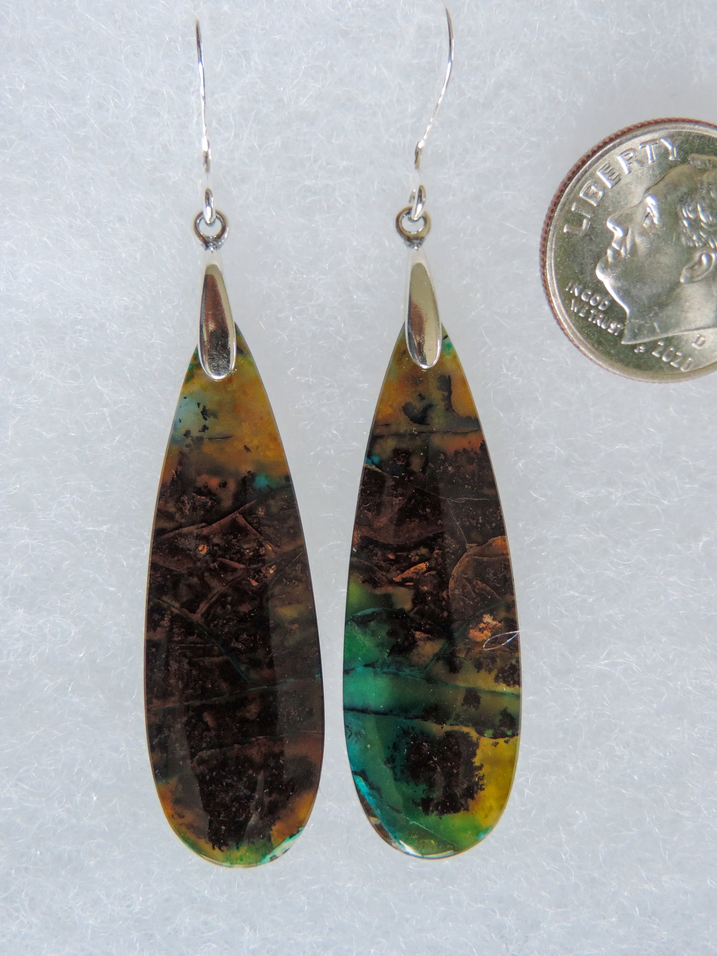 Extremely rare and lovely, Indonesian Blue Opalized Wood is a cherished material used by lapidary artists for creating stunning pieces of jewelry. The material was first found as pebbles and rounded stones in streams and near the slopes of three volcanoes in the West Java Province.