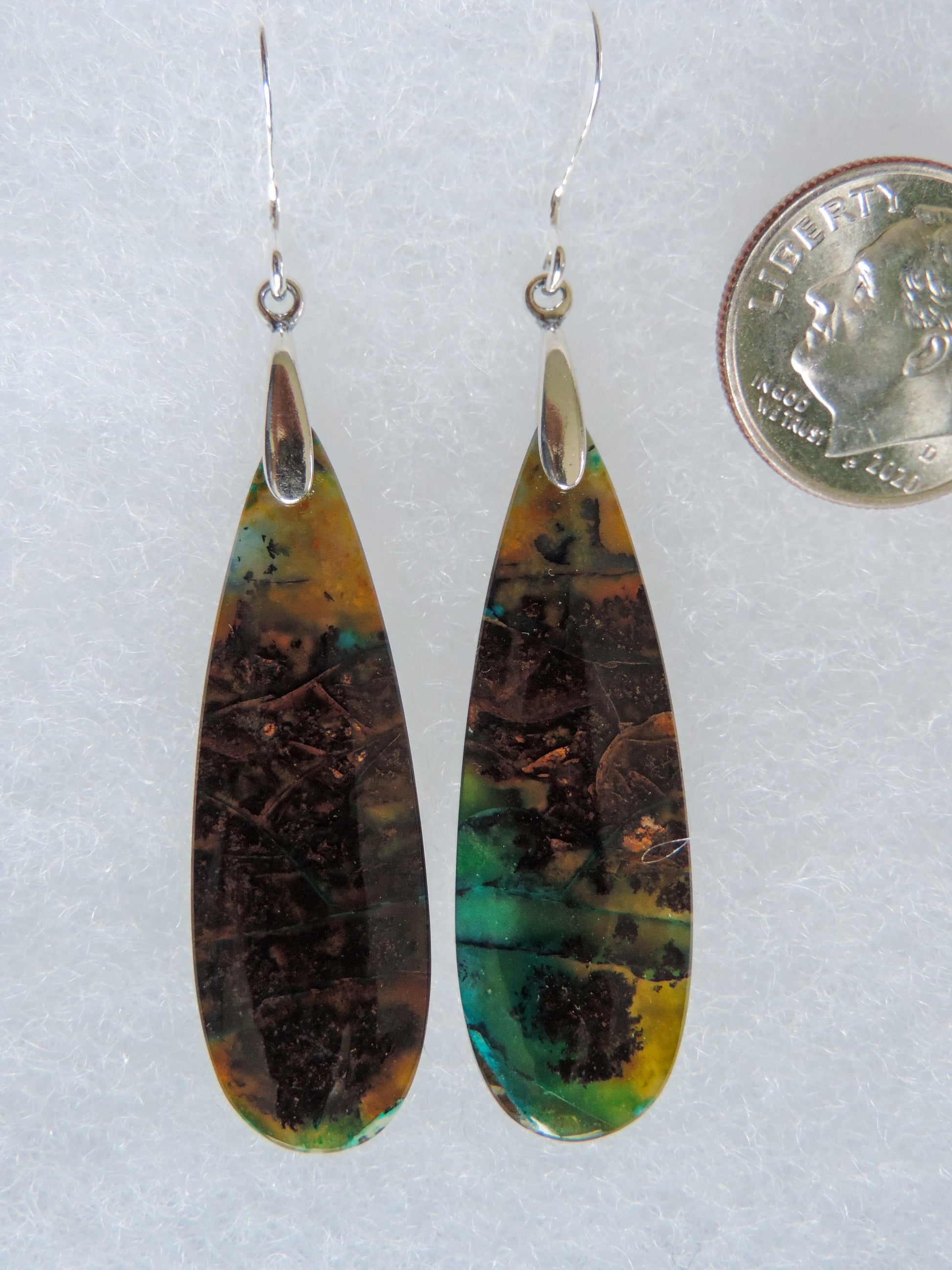 Extremely rare and lovely, Indonesian Blue Opalized Wood is a cherished material used by lapidary artists for creating stunning pieces of jewelry.  The material was first found as pebbles and rounded stones in streams and near the slopes of three volcanoes in the West Java Province.