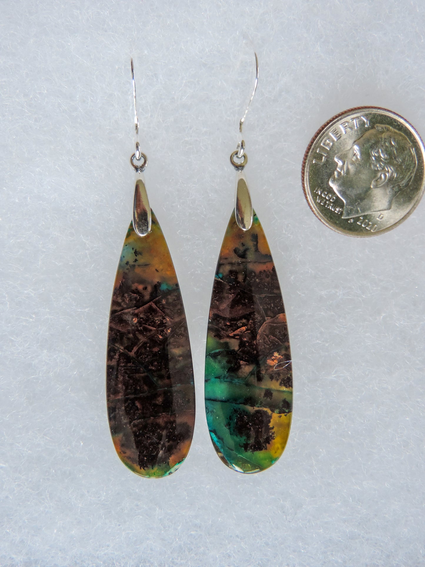 This stone is a natural color, no dyes or heat treatment have been used. It was photographed without filters on automatic setting in natural light; however, slight color variations may occur due to digitization. Natural stones can have nooks and crannies, inclusions or small cracks, these distinguishing features lend character to the piece.
