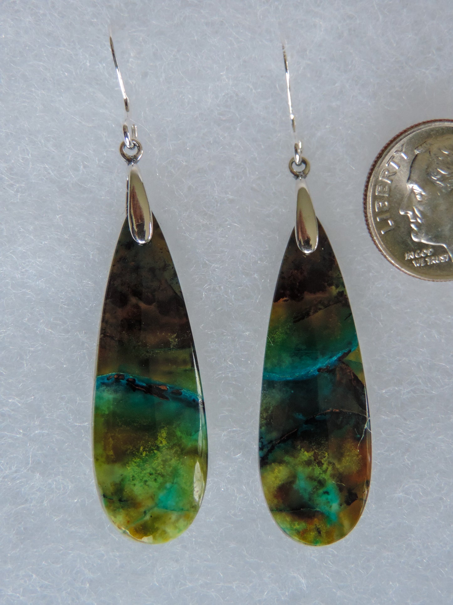 Extremely rare and lovely, Indonesian Blue Opalized Wood is a cherished material used by lapidary artists for creating stunning pieces of jewelry.  The material was first found as pebbles and rounded stones in streams and near the slopes of three volcanoes in the West Java Province.  The source deposit, an ancient petrified forest covered with pyroclastic flow from a volcanic eruption, was located in 2017 on the steep slopes of Mt. Tjakalak.