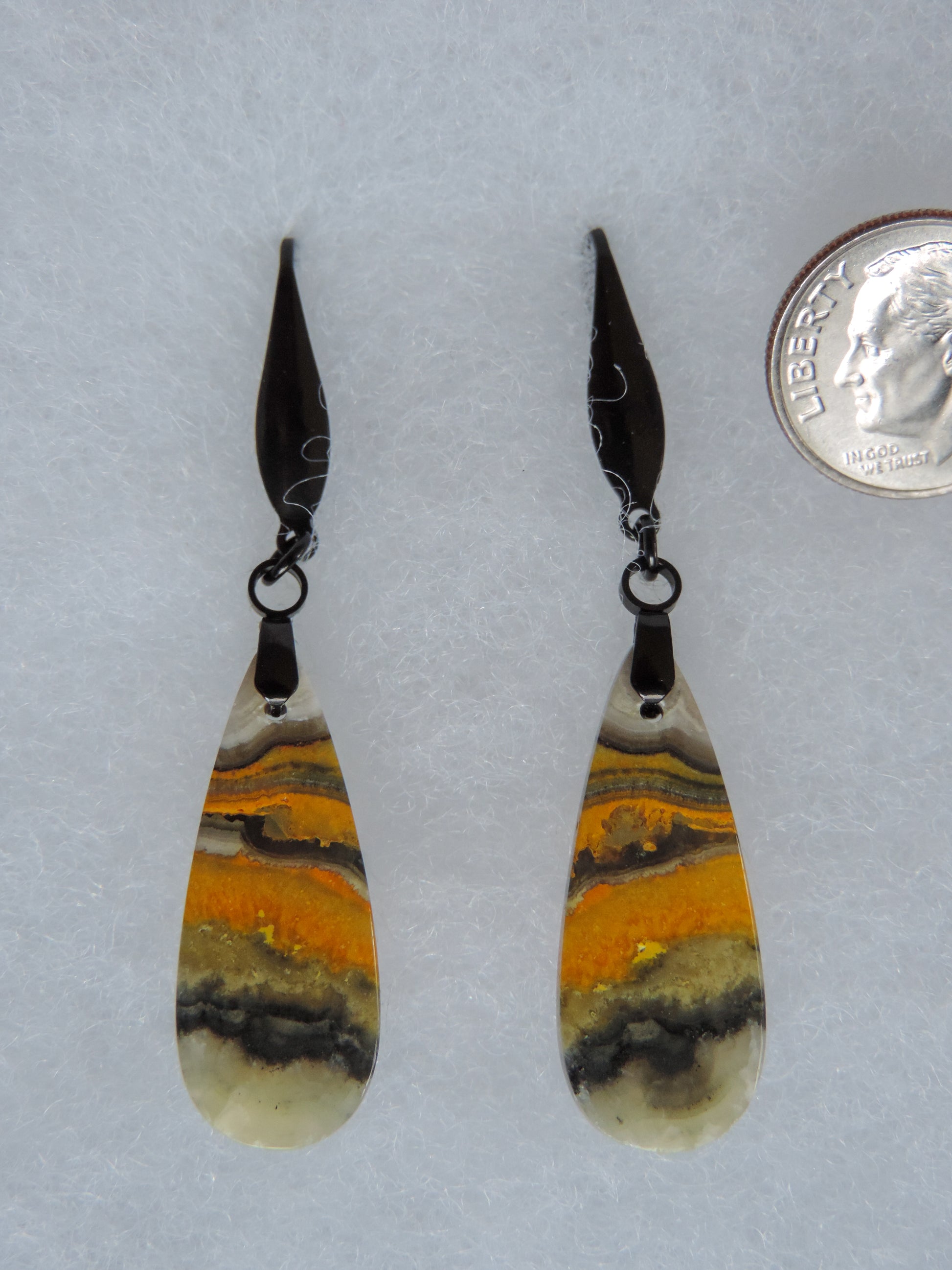 Bumblebee Jasper is named for its yellow, white, orange and black colored banding which resembles a common bumblebee.  This mineral was discovered in the Papandayan Volcano, West Java Province, Indonesia.  The gemstone is truly unique in appearance, fun to wear and is known spiritually for its uplifting, radiant energy.