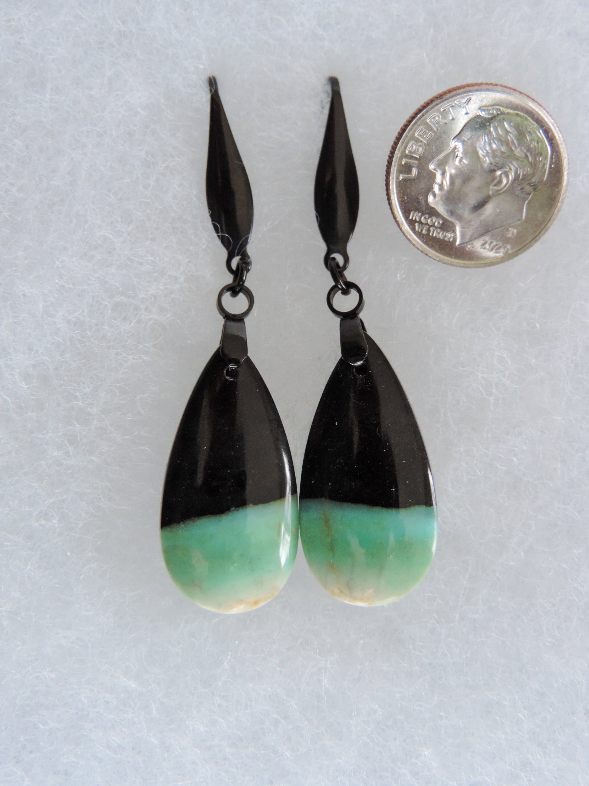 Extremely rare and lovely, Indonesian Blue Opalized Wood is a cherished material used by lapidary artists for creating stunning pieces of jewelry.  The material was first found as pebbles and rounded stones in streams and near the slopes of three volcanoes in the West Java Province.