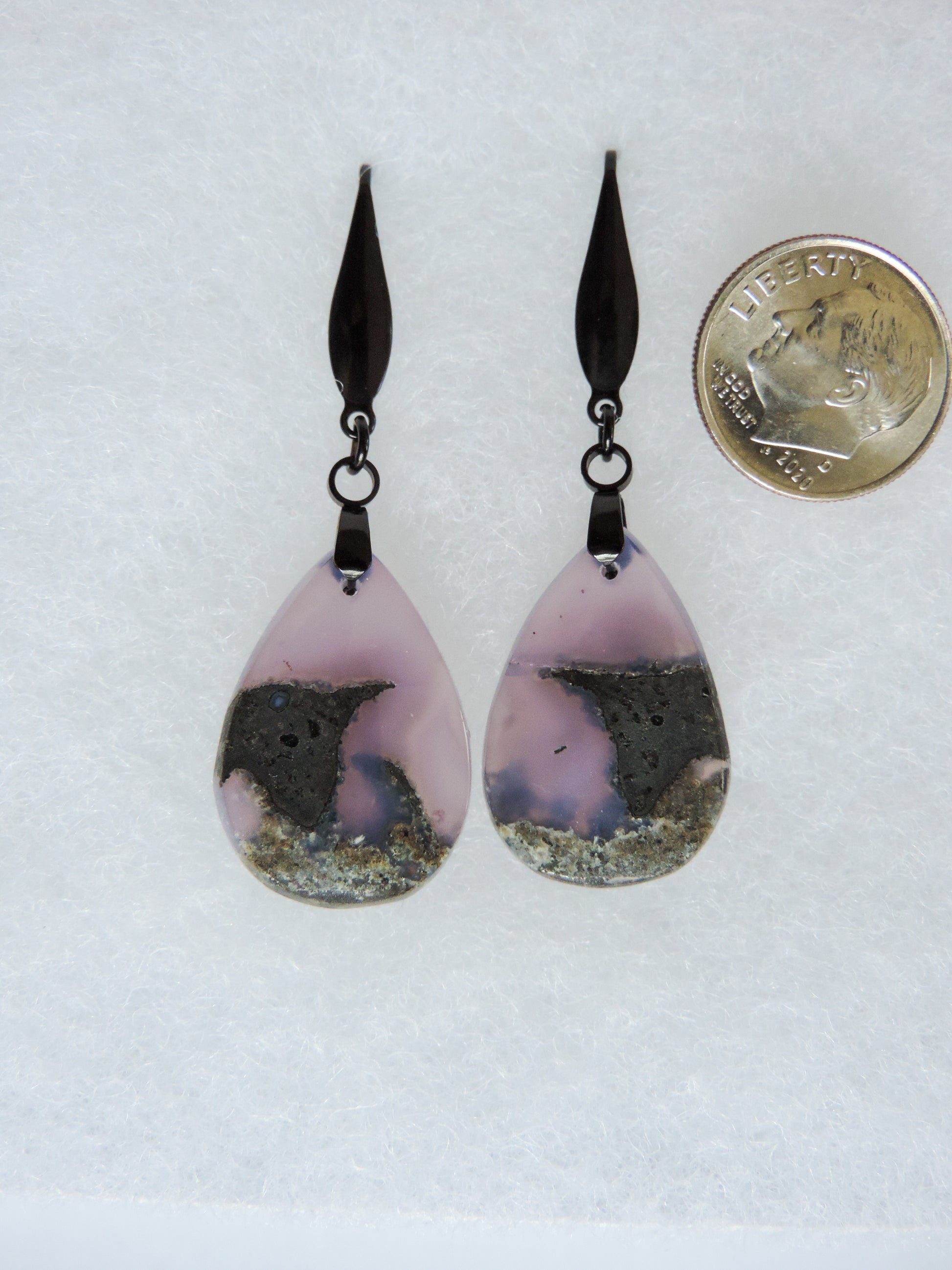 Purple gemstones hold significant and powerful spiritual qualities.  Purple has been associated with wealth, passion, ambition, magic, awareness, mystery, tranquility, inspiration, understanding, calmness and wisdom to name a few.