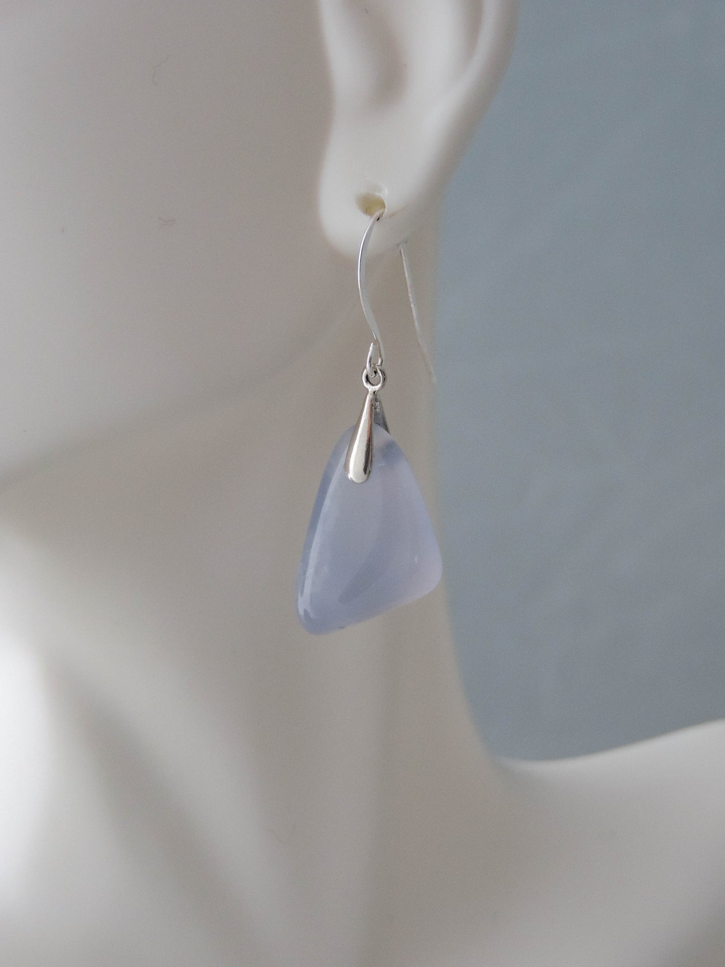 The bail and earring wires are authentic 925 sterling silver.  Wear these original earrings and stand out in a crowd!  Known as the Treasure State, Montana’s landscape is an abundant resource for precious and semi-precious stones.  One of the semi-precious stones, Madison Blue Agate, are featured in these earrings.