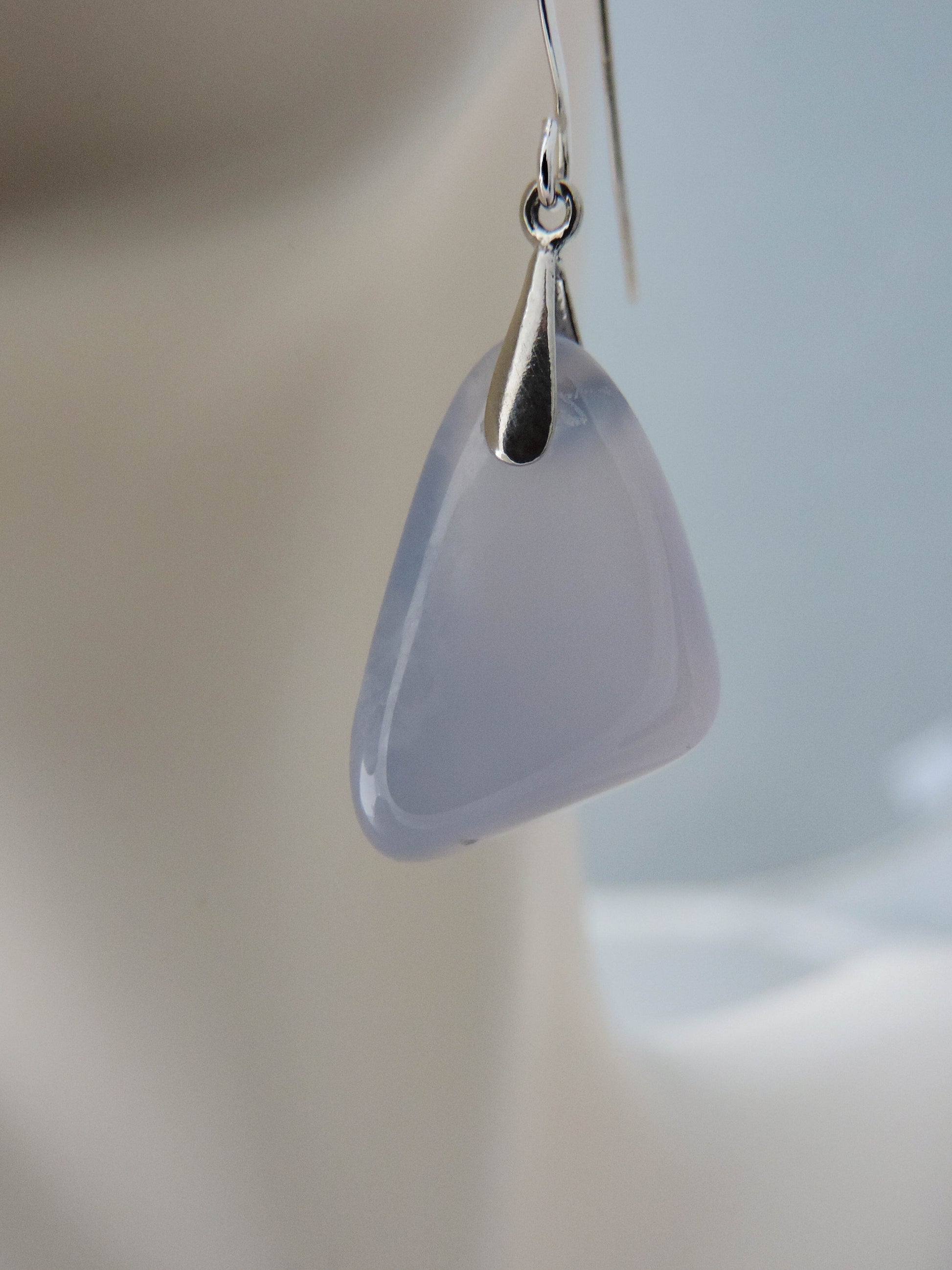 The bail and earring wires are authentic 925 sterling silver.  Wear these original earrings and stand out in a crowd!  Known as the Treasure State, Montana’s landscape is an abundant resource for precious and semi-precious stones.  One of the semi-precious stones, Madison Blue Agate, are featured in these earrings.