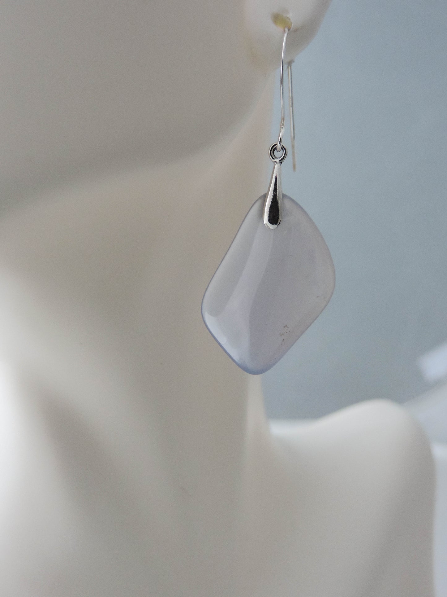 The bail and earring wires are authentic 925 sterling silver.  Wear these original earrings and stand out in a crowd!  Known as the Treasure State, Montana’s landscape is an abundant resource for precious and semi-precious stones.  One of the semi-precious stones, Madison Blue Agate, are featured in these earrings.