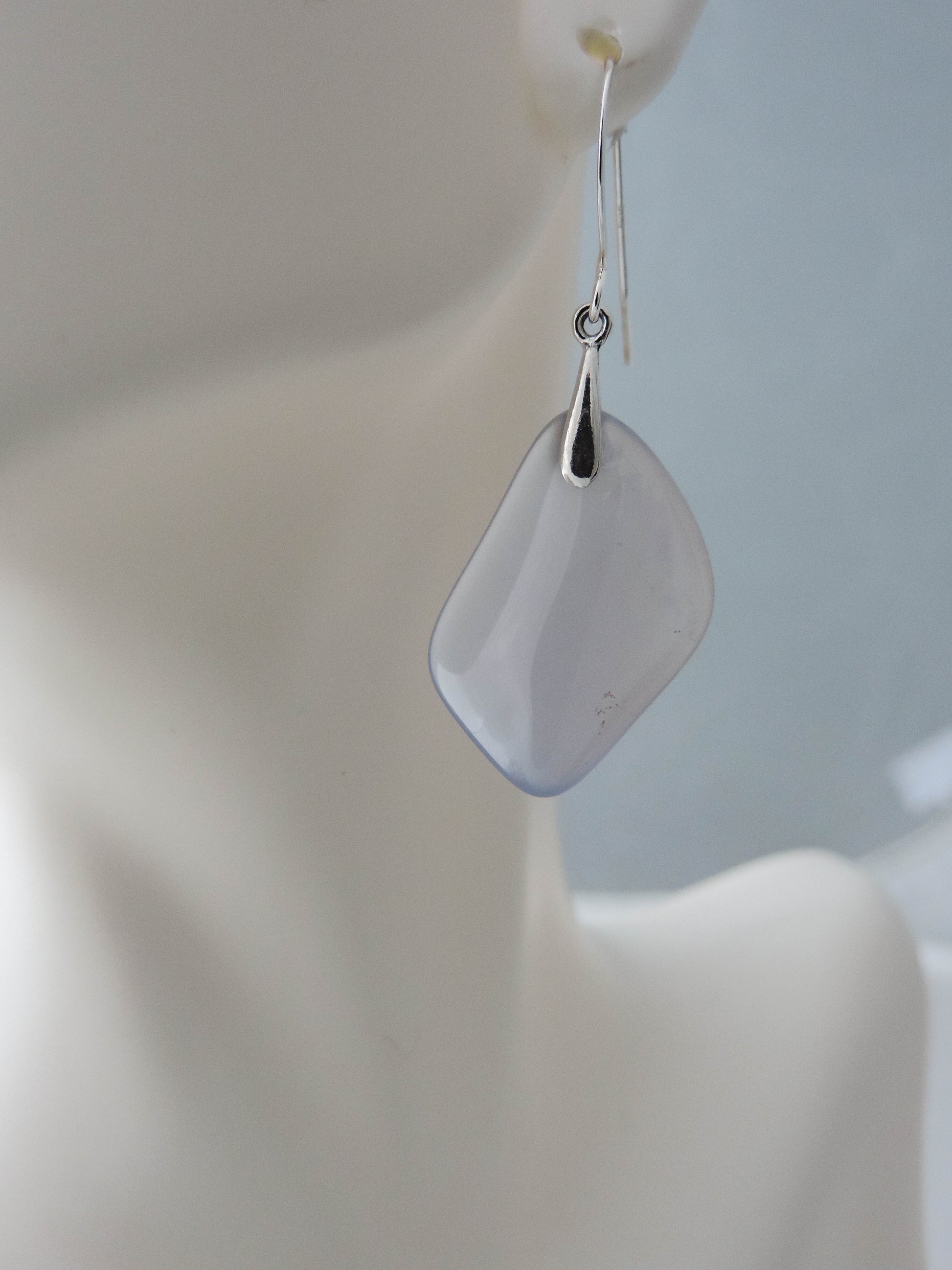 The bail and earring wires are authentic 925 sterling silver.  Wear these original earrings and stand out in a crowd!  Known as the Treasure State, Montana’s landscape is an abundant resource for precious and semi-precious stones.  One of the semi-precious stones, Madison Blue Agate, are featured in these earrings.