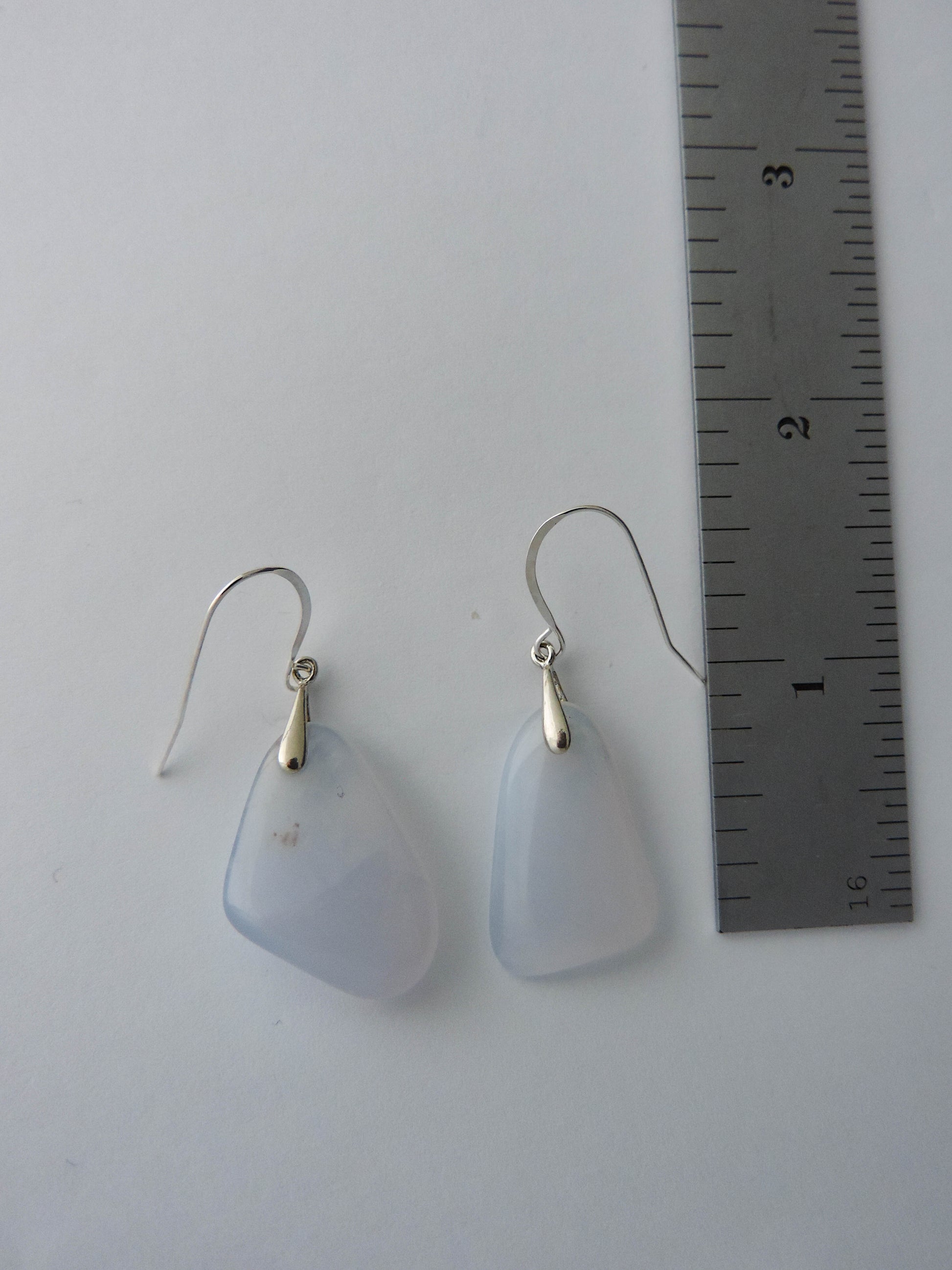 The bail and earring wires are authentic 925 sterling silver.  Wear these original earrings and stand out in a crowd!  Known as the Treasure State, Montana’s landscape is an abundant resource for precious and semi-precious stones.  One of the semi-precious stones, Madison Blue Agate, are featured in these earrings.