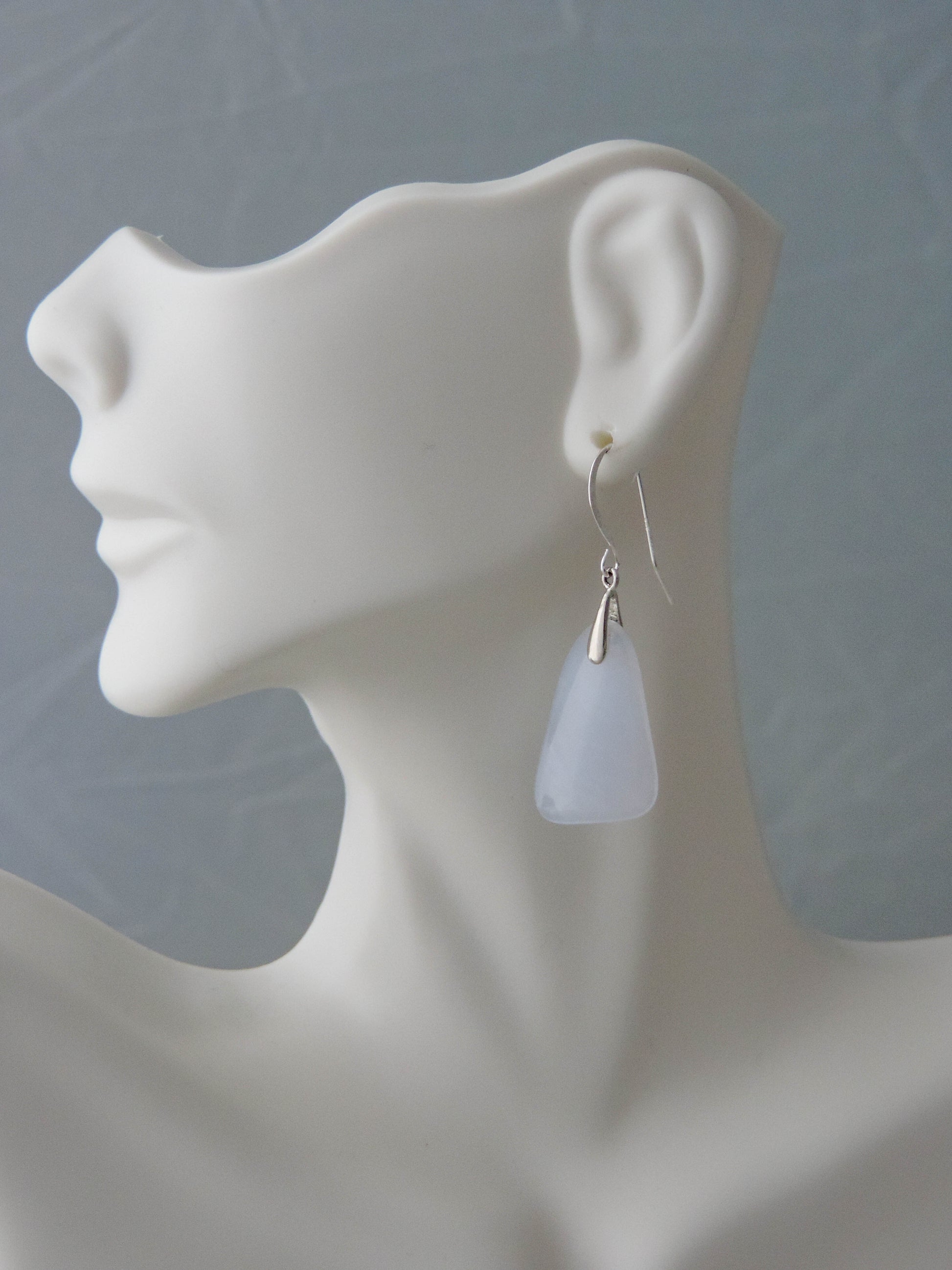 The bail and earring wires are authentic 925 sterling silver.  Wear these original earrings and stand out in a crowd!  Known as the Treasure State, Montana’s landscape is an abundant resource for precious and semi-precious stones.  One of the semi-precious stones, Madison Blue Agate, are featured in these earrings.