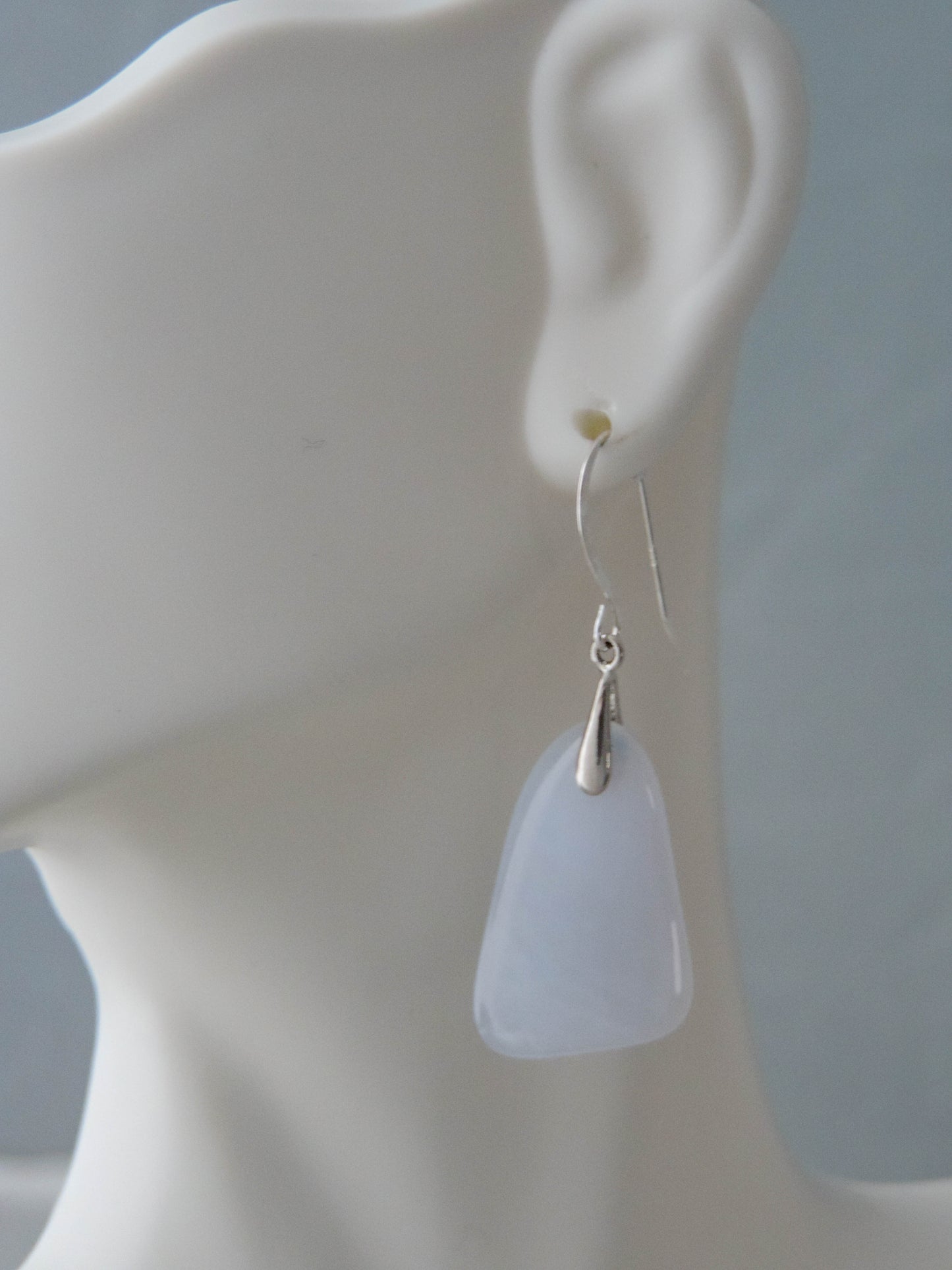 The bail and earring wires are authentic 925 sterling silver.  Wear these original earrings and stand out in a crowd!  Known as the Treasure State, Montana’s landscape is an abundant resource for precious and semi-precious stones.  One of the semi-precious stones, Madison Blue Agate, are featured in these earrings.