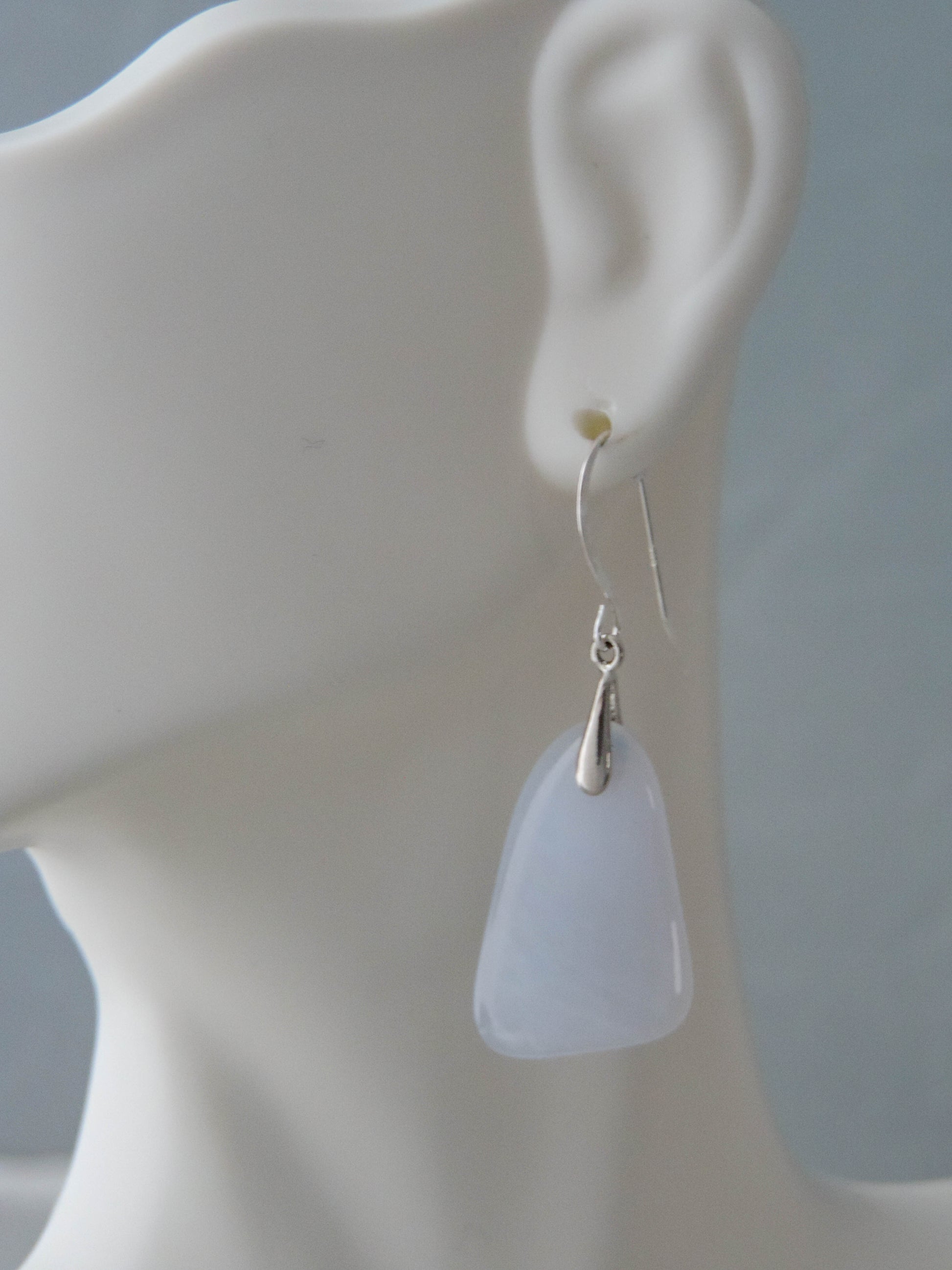 The bail and earring wires are authentic 925 sterling silver.  Wear these original earrings and stand out in a crowd!  Known as the Treasure State, Montana’s landscape is an abundant resource for precious and semi-precious stones.  One of the semi-precious stones, Madison Blue Agate, are featured in these earrings.