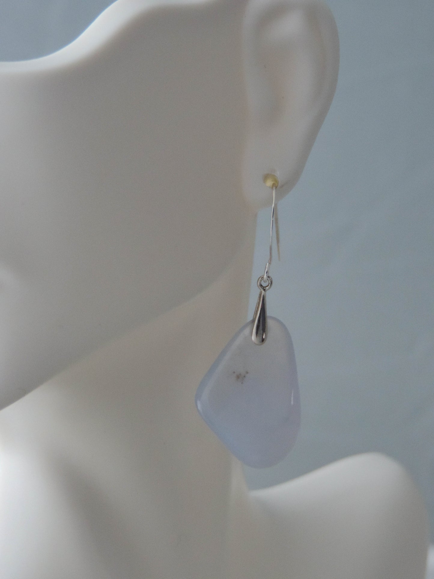 The bail and earring wires are authentic 925 sterling silver.  Wear these original earrings and stand out in a crowd!  Known as the Treasure State, Montana’s landscape is an abundant resource for precious and semi-precious stones.  One of the semi-precious stones, Madison Blue Agate, are featured in these earrings.