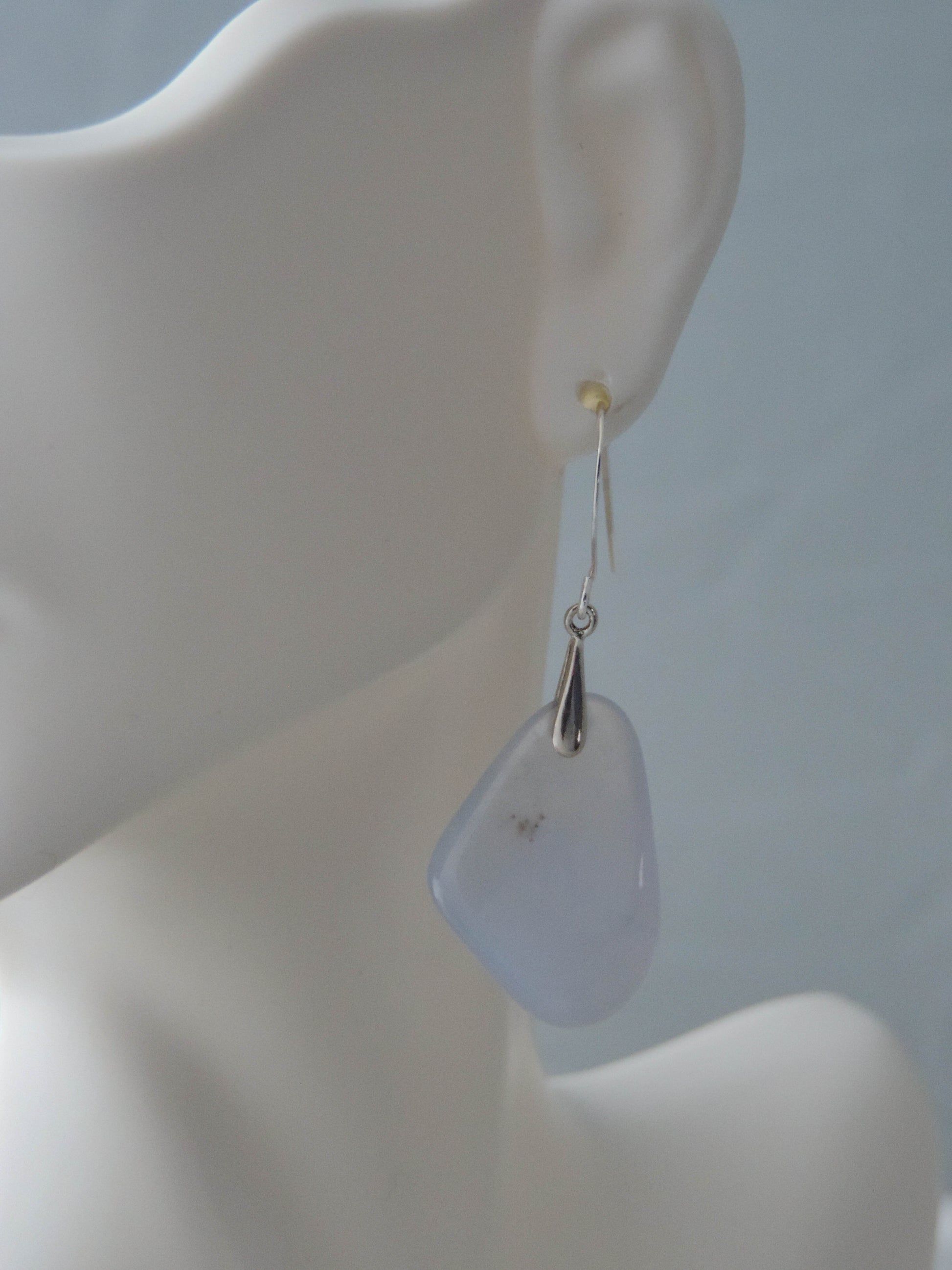 The bail and earring wires are authentic 925 sterling silver.  Wear these original earrings and stand out in a crowd!  Known as the Treasure State, Montana’s landscape is an abundant resource for precious and semi-precious stones.  One of the semi-precious stones, Madison Blue Agate, are featured in these earrings.