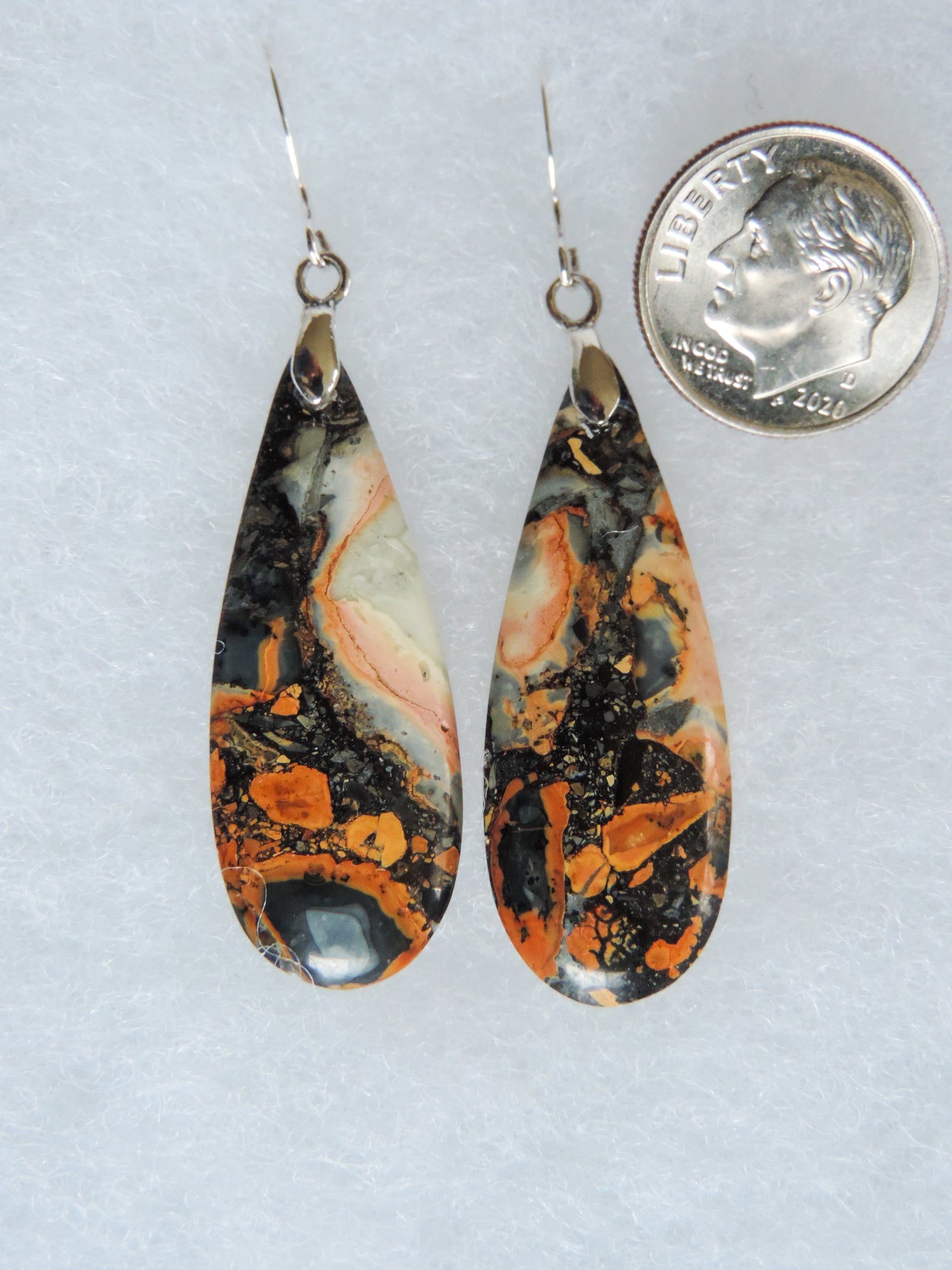 Found roughly ten years ago, this stone has made its way into the main stream market.  The bail and earring wires are authentic 925 sterling silver.  This stone is