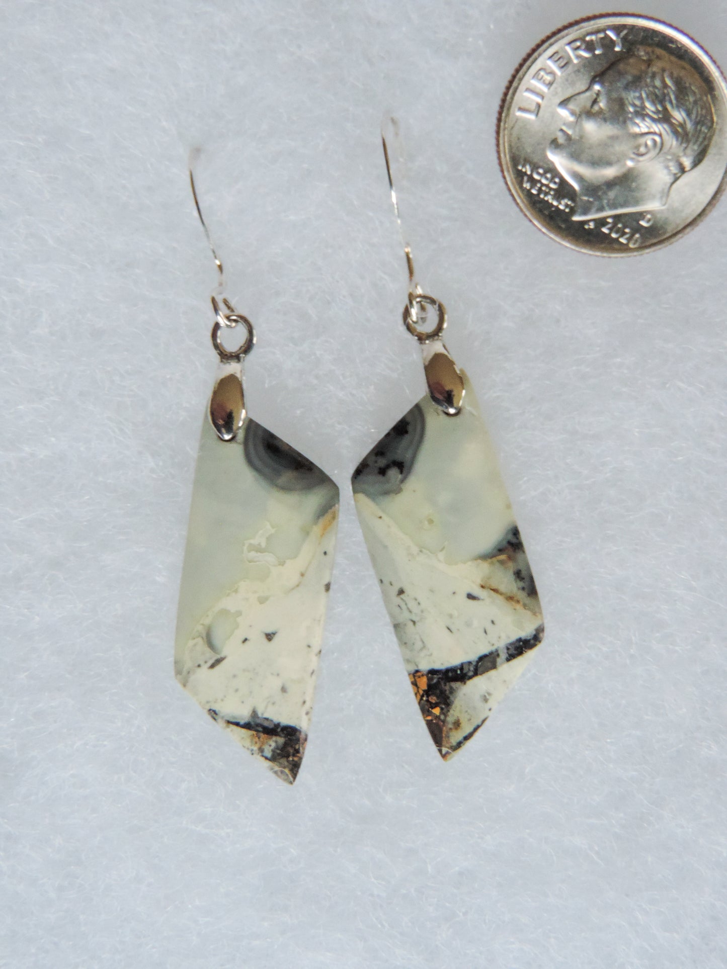 The bail and earring wires are authentic 925 sterling silver.  This stone is a natural color, no dyes or heat treatment have been used.  It was photographed without filters natural light; however, slight color variations may occur due to digitization.