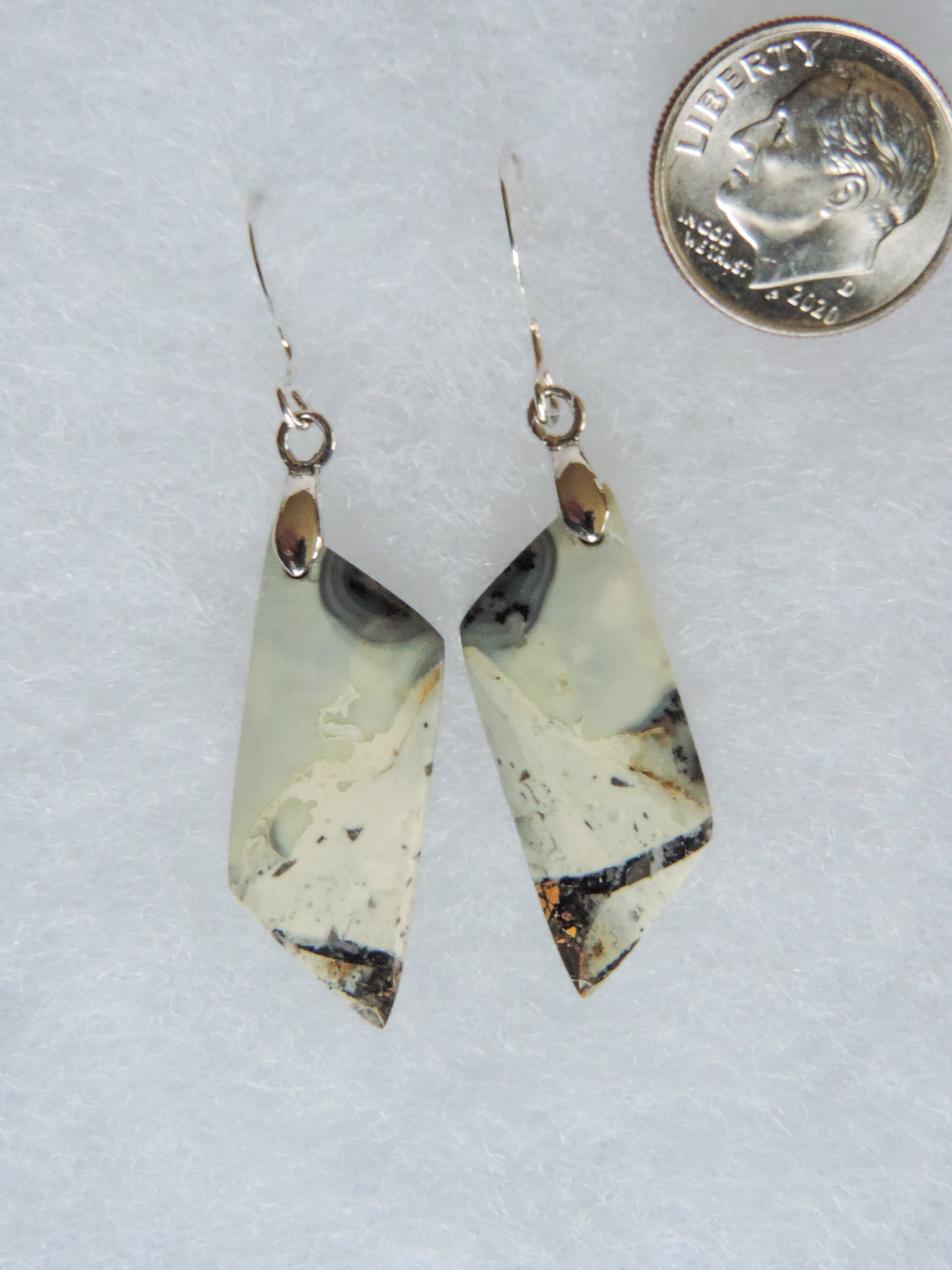 The bail and earring wires are authentic 925 sterling silver.  This stone is a natural color, no dyes or heat treatment have been used.  It was photographed without filters natural light; however, slight color variations may occur due to digitization.