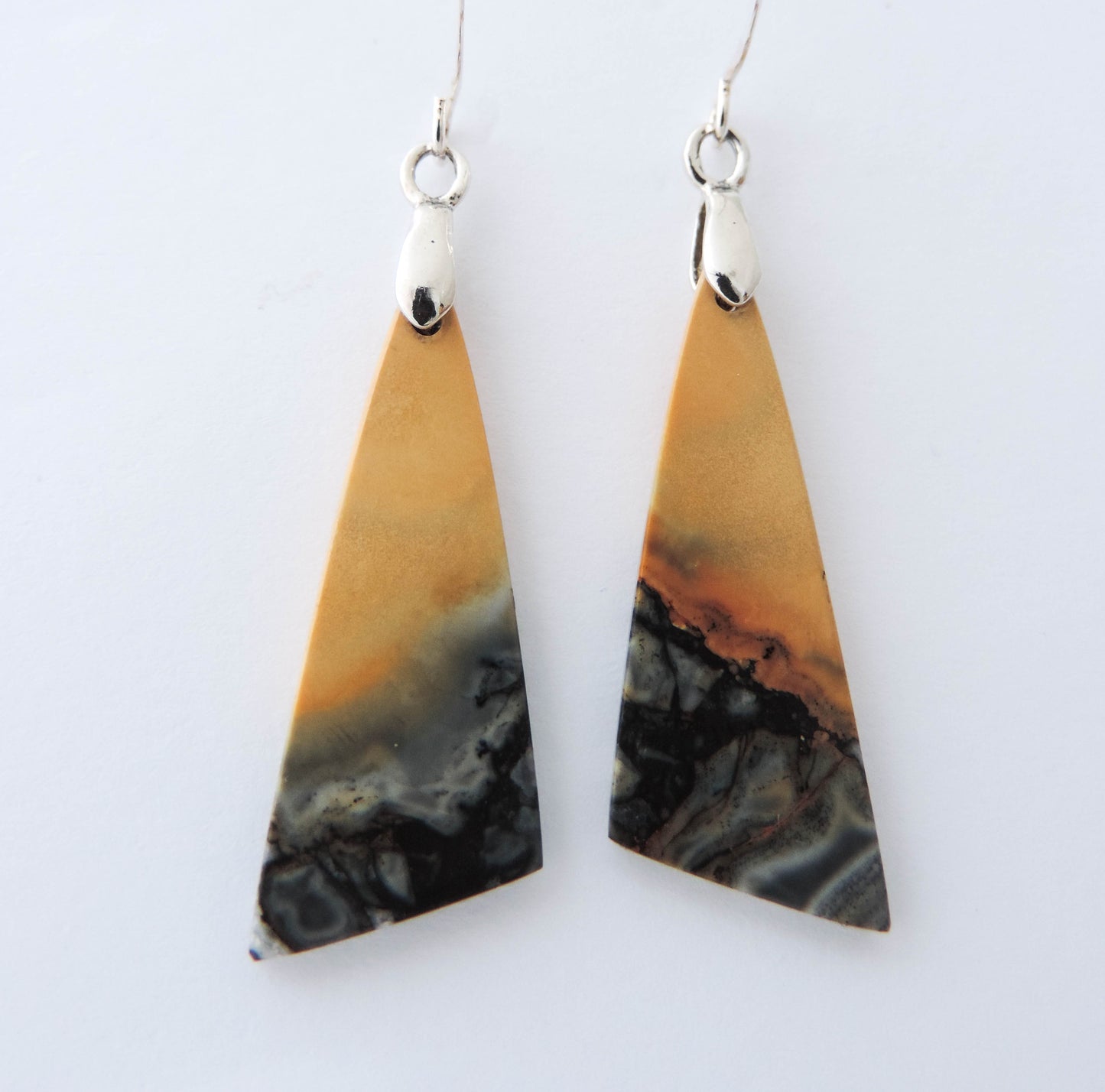 Maligano Jasper is a specific type of jasper found in Indonesia and forms in ancient volcanic hot springs areas. It’s named after a small village in Sulawesi, Indonesia and is mined by hand. Exquisite in appearance, this jewelry will compliment your formal or casual attire. The bail and earring wires are authentic 925 sterling silver.