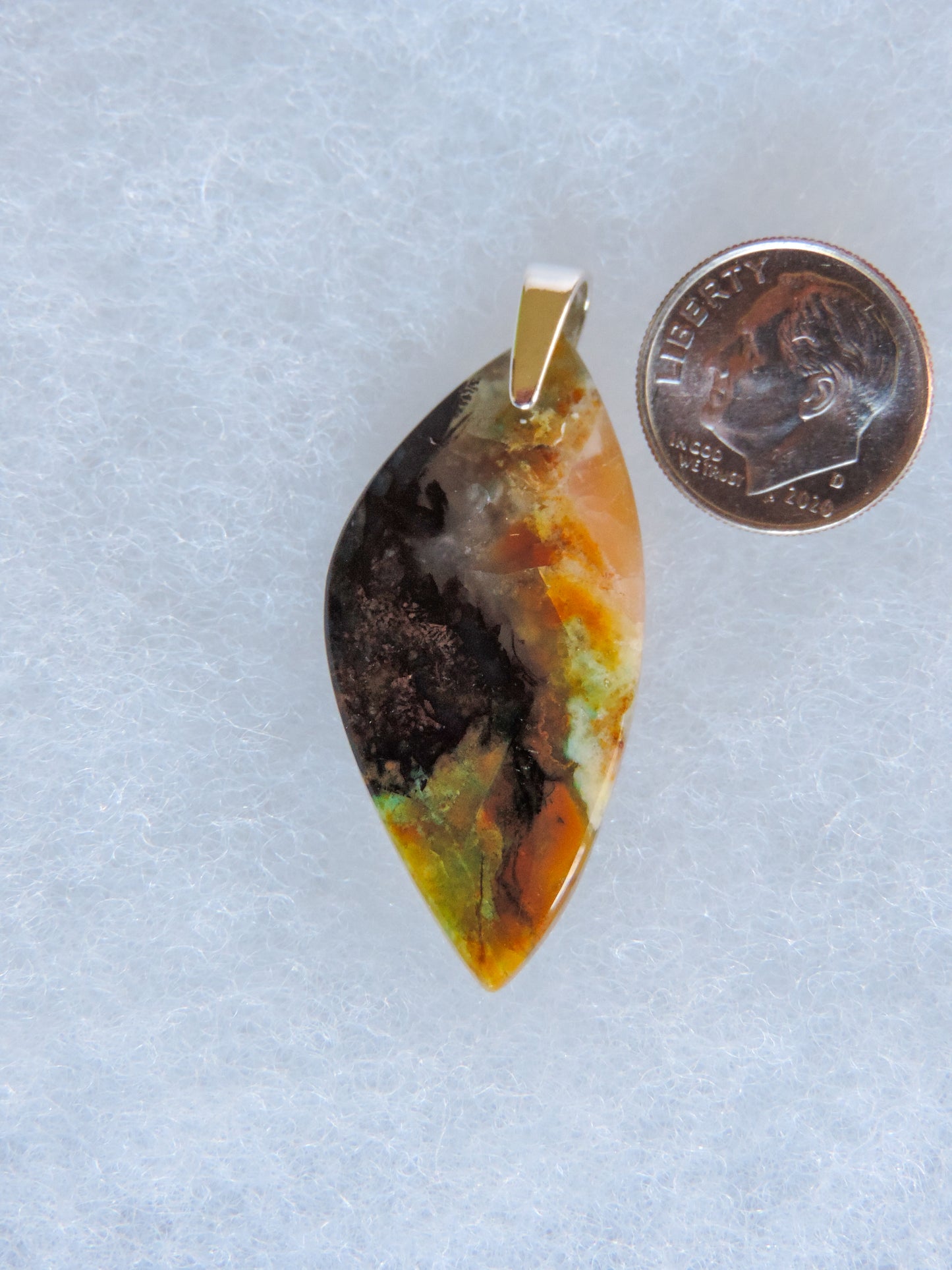 The pendant bail is authentic 925 sterling silver.  Feel treasured when you wear this stunning pendant!  This stone is a natural color, no dyes or heat treatment have been used.  It was photographed without filters in natural light; however, slight color variations may occur due to digitization.  Natural stones can have