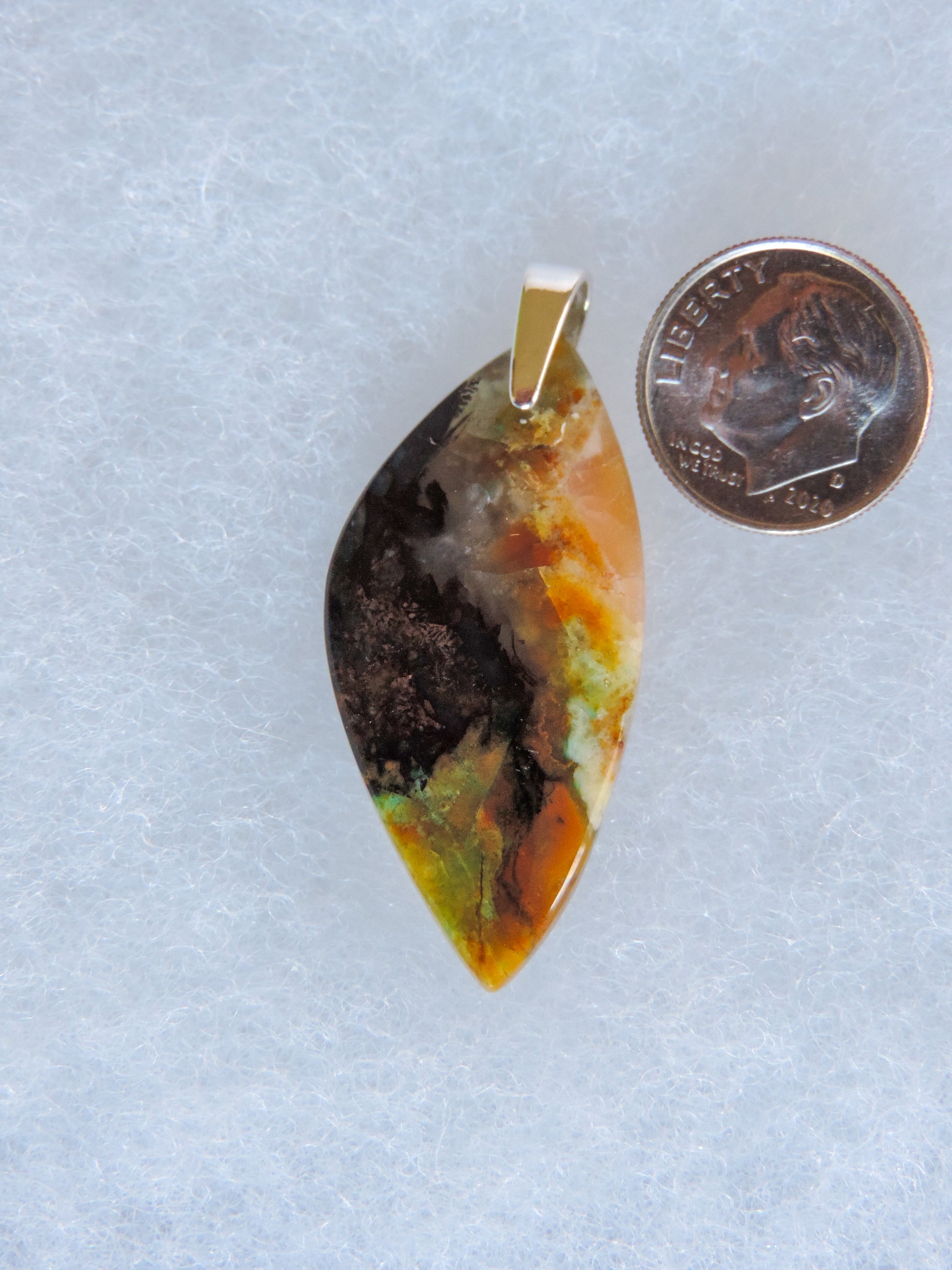 The pendant bail is authentic 925 sterling silver.  Feel treasured when you wear this stunning pendant!  This stone is a natural color, no dyes or heat treatment have been used.  It was photographed without filters in natural light; however, slight color variations may occur due to digitization.  Natural stones can have