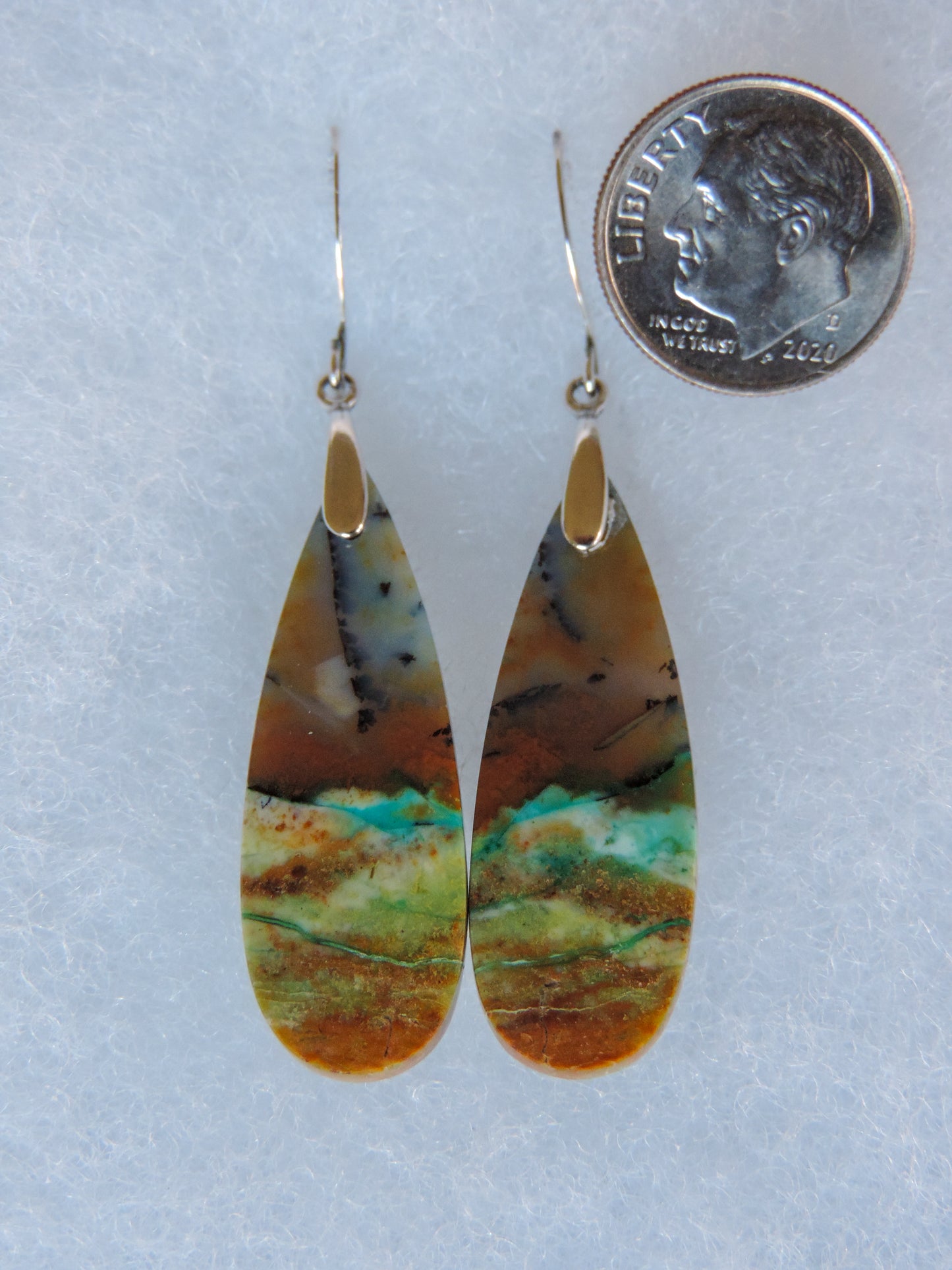 Extremely rare and lovely, Indonesian Blue Opalized Wood is a cherished material used by lapidary artists for creating stunning pieces of jewelry. The material was first found as pebbles and rounded stones in streams and near the slopes of three volcanoes in the West Java Province.