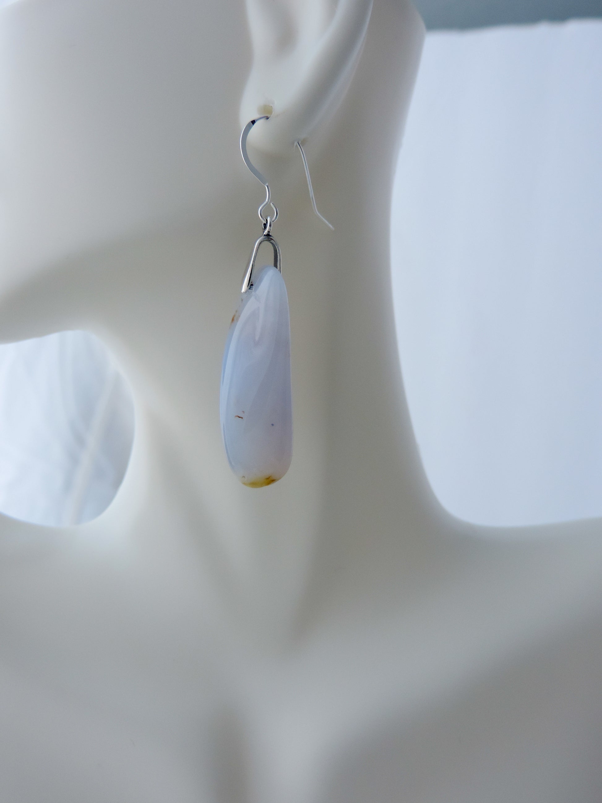 The bail and earring wires are authentic 925 sterling silver.  Wear these original earrings and stand out in a crowd!  Known as the Treasure State, Montana’s landscape is an abundant resource for precious and semi-precious stones.  One of the semi-precious stones, Madison Blue Agate, are featured in these earrings.