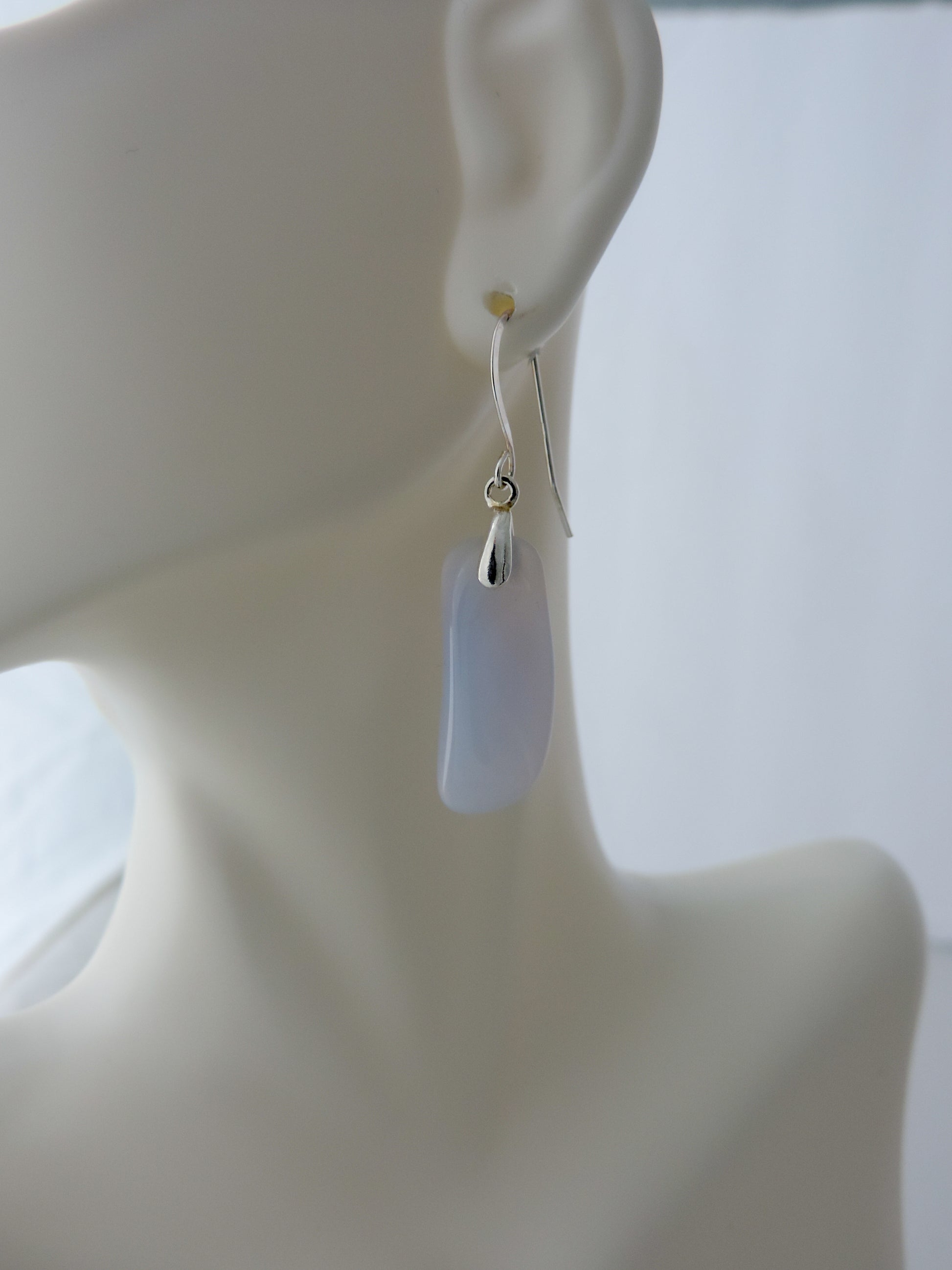 The bail and earring wires are authentic 925 sterling silver.  Wear these original earrings and stand out in a crowd!  Known as the Treasure State, Montana’s landscape is an abundant resource for precious and semi-precious stones.  One of the semi-precious stones, Madison Blue Agate, are featured in these earrings.