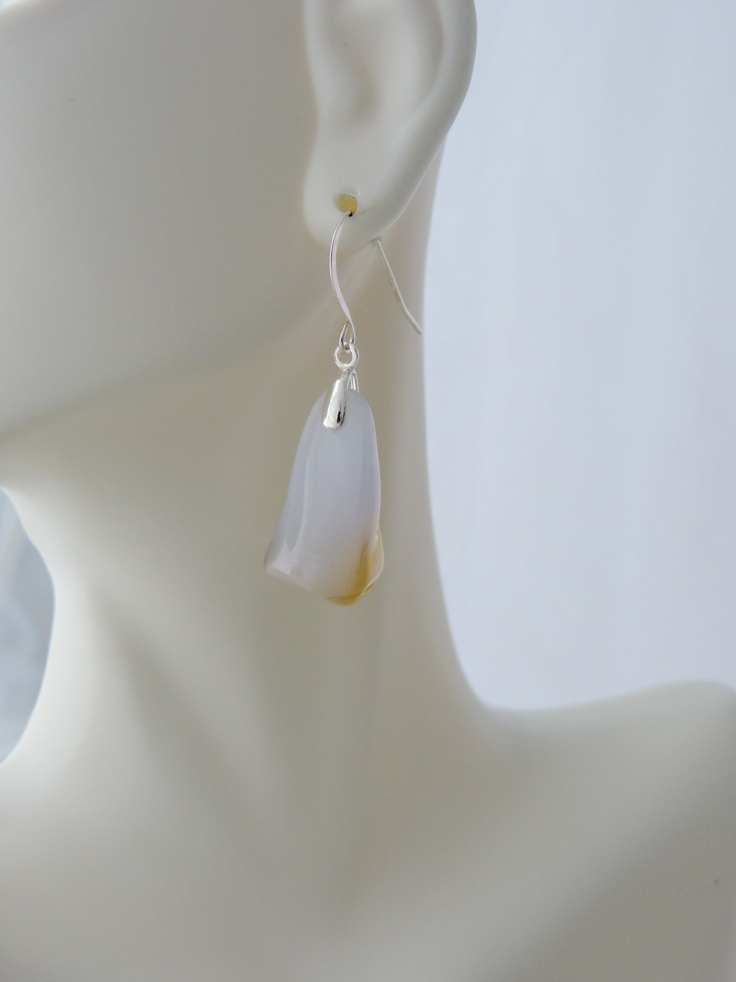 The bail and earring wires are authentic 925 sterling silver.  Wear these original earrings and stand out in a crowd!  Known as the Treasure State, Montana’s landscape is an abundant resource for precious and semi-precious stones.  One of the semi-precious stones, Madison Blue Agate, are featured in these earrings.