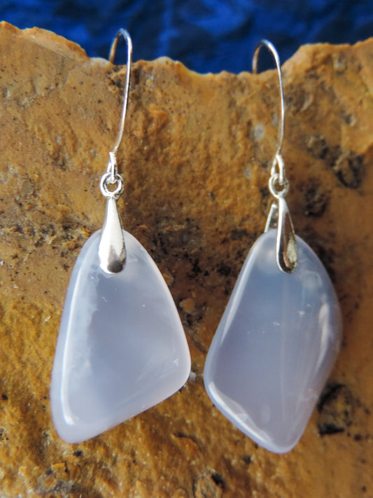 The bail and earring wires are authentic 925 sterling silver.  Wear these original earrings and stand out in a crowd!  Known as the Treasure State, Montana’s landscape is an abundant resource for precious and semi-precious stones.  One of the semi-precious stones, Madison Blue Agate, are featured in these earrings.