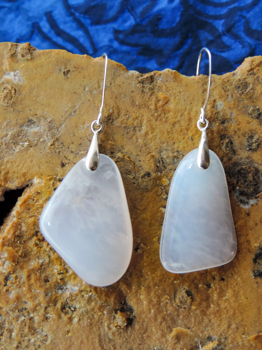 The bail and earring wires are authentic 925 sterling silver.  Wear these original earrings and stand out in a crowd!  Known as the Treasure State, Montana’s landscape is an abundant resource for precious and semi-precious stones.  One of the semi-precious stones, Madison Blue Agate, are featured in these earrings.