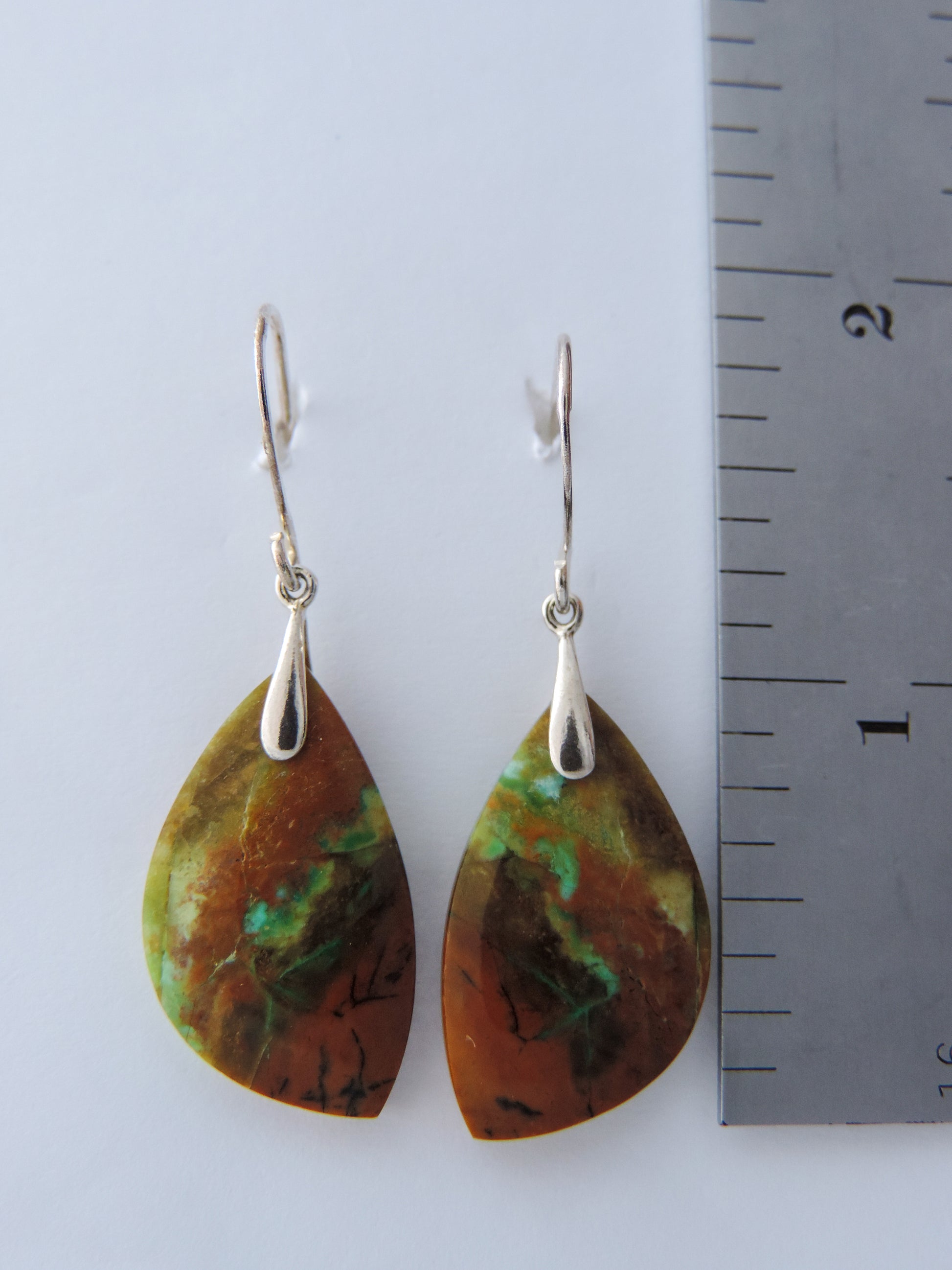 Feel treasured when you wear these Indonesian Blue Opalized Wood Earrings   Our hand crafted jewelry earrings are photographed next to a ruler for size.  This stone is a natural color, no dyes or heat treatment have been used.