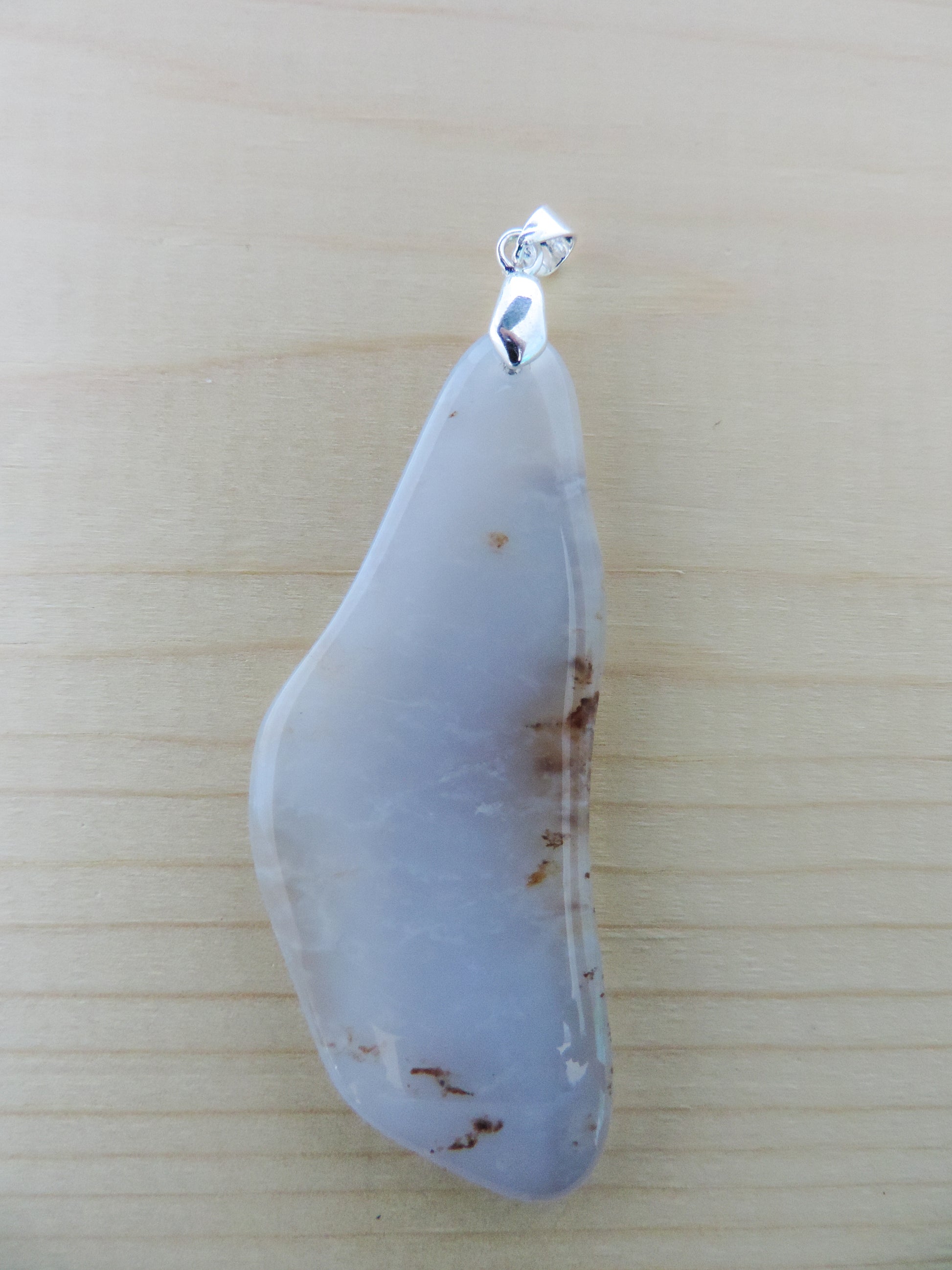 This rare stone is found in only a few locations in Montana, our material is hand collected on private property in the mountains and carried out in backpacks...each piece worth its weight in every step!  The translucent blue agate and its color variations have an alluring effect, many people find the blue agate a relaxing, calming and peaceful stone to wear.  Original and unique in design, each piece is hand crafted by lapidary artists in Montana.