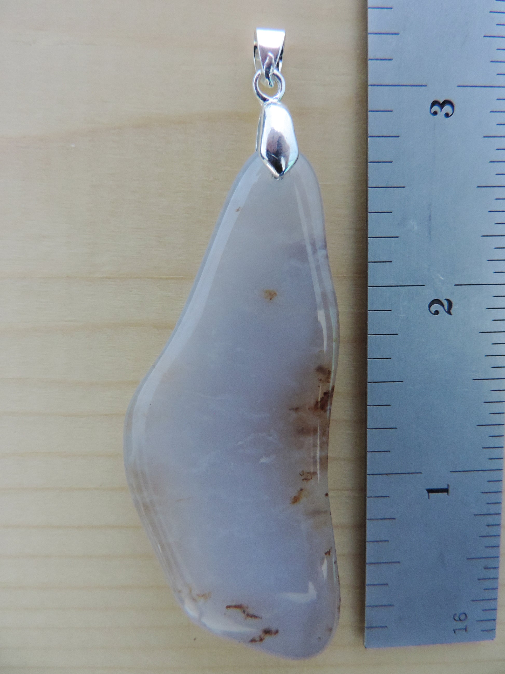 This rare stone is found in only a few locations in Montana, our material is hand collected on private property in the mountains and carried out in backpacks...each piece worth its weight in every step!  The translucent blue agate and its color variations have an alluring effect, many people find the blue agate a relaxing, calming and peaceful stone to wear.  Original and unique in design, each piece is hand crafted by lapidary artists in Montana.