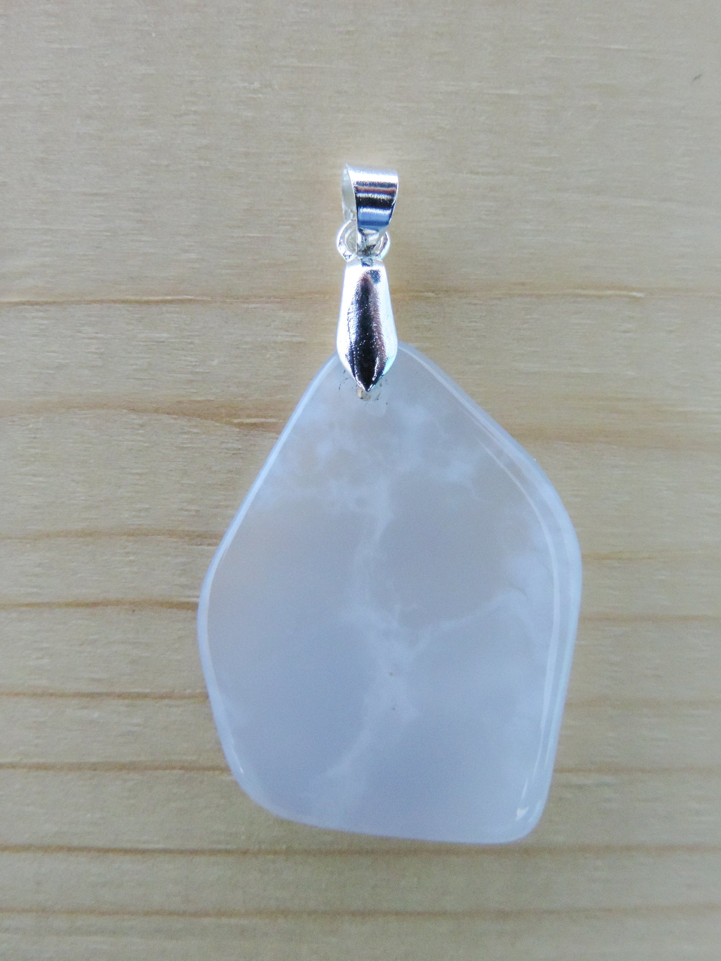 This rare stone is found in only a few locations in Montana, our material is hand collected on private property in the mountains and carried out in backpacks...each piece worth its weight in every step!  The translucent blue agate and its color variations have an alluring effect, many people find the blue agate a relaxing, calming and peaceful stone to wear.  Original and unique in design, each piece is hand crafted by lapidary artists in Montana.