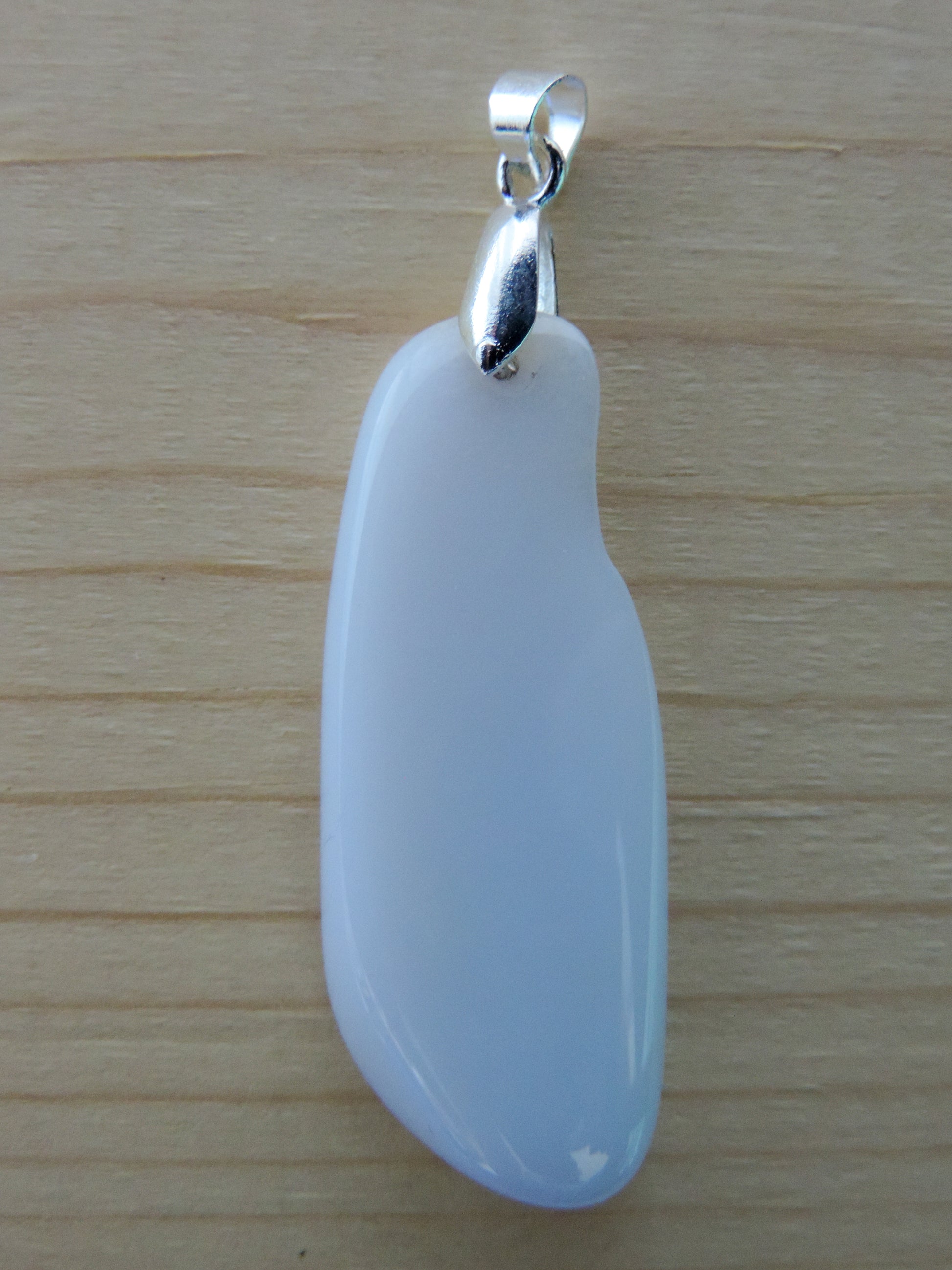 This rare stone is found in only a few locations in Montana, our material is hand collected on private property in the mountains and carried out in backpacks...each piece worth its weight in every step!  The translucent blue agate and its color variations have an alluring effect, many people find the blue agate a relaxing, calming and peaceful stone to wear.  Original and unique in design, each piece is hand crafted by lapidary artists in Montana.